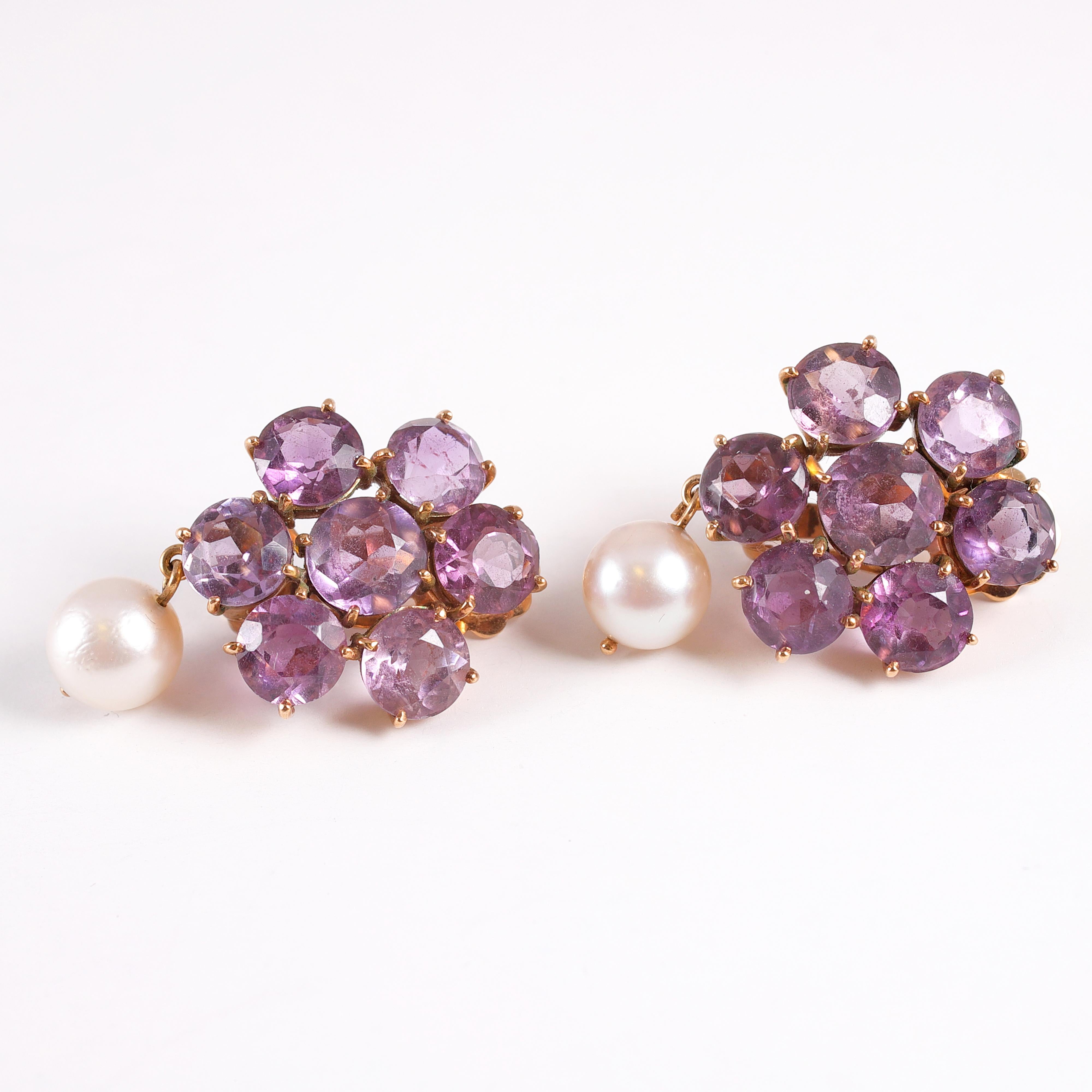 A truly lovely pair of vintage amethyst and pearl, clip on earrings.  The amethysts have a total estimated weight of 13.50 carats and the 7.00 mm cultured pearls are a perfect compliment to the beautiful purple tones!