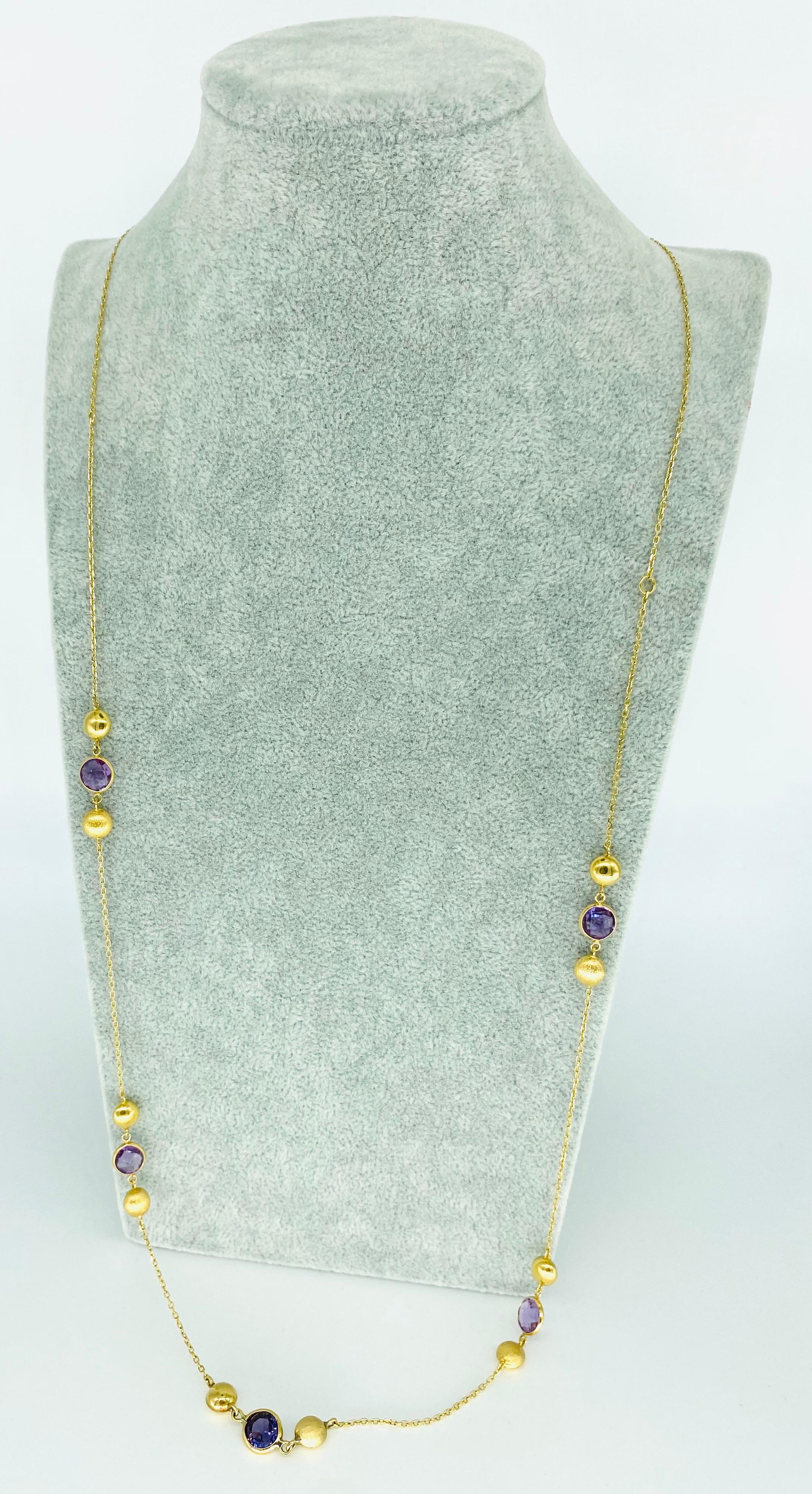 Vintage Amethyst & Purple Topaz Gemstone Long Necklace 35 Inches 18 Karat Gold. Dazzling amethyst gemstones in this extra long necklace. Featuring four amethyst measuring 8.5mm each & one purple topaz gemstone measuring 9mm. The back lace weights