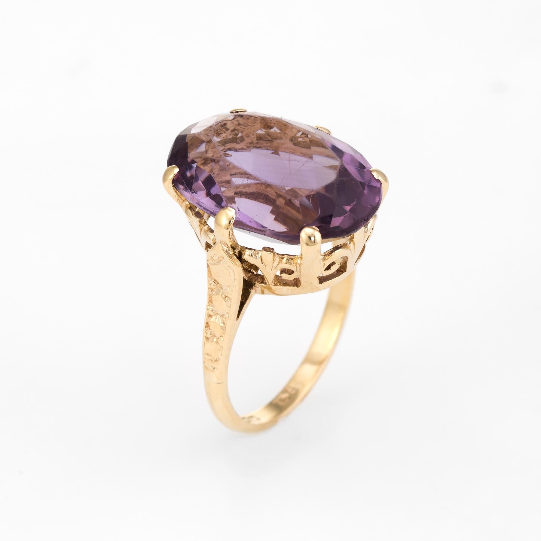 Circa 1972, a finely detailed vintage cocktail ring is crafted in 9 karat yellow gold. 

The large faceted oval cut amethyst measures 18mm x 13mm and is estimated at 11 carats. The amethyst is in excellent condition and free of cracks or chips. we