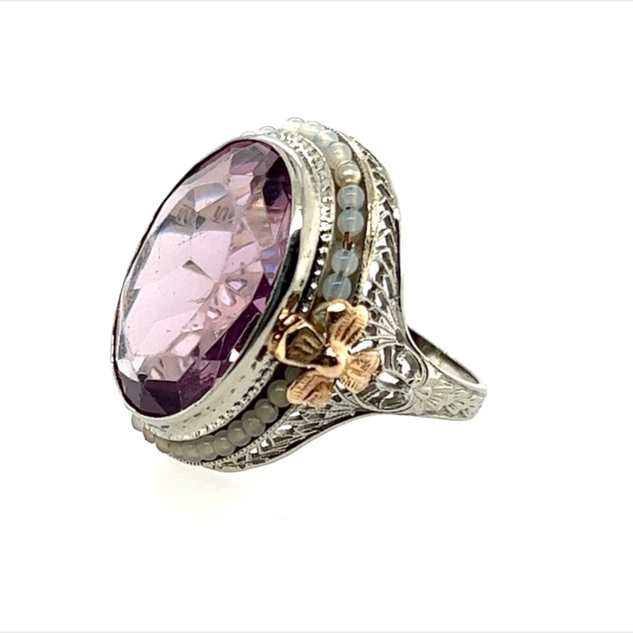 Genuine Original Art Deco Antique from 1920's - 1930's  Amethyst Ring with Seed Pearls and Rose Gold Flowers 14 Carat Oval  10K 


Featuring a GIGANTIC 14 Carat Natural Oval Amethyst Gemstone Center

Stunning Seed Pearl Border

Two, Hand Cut Rose