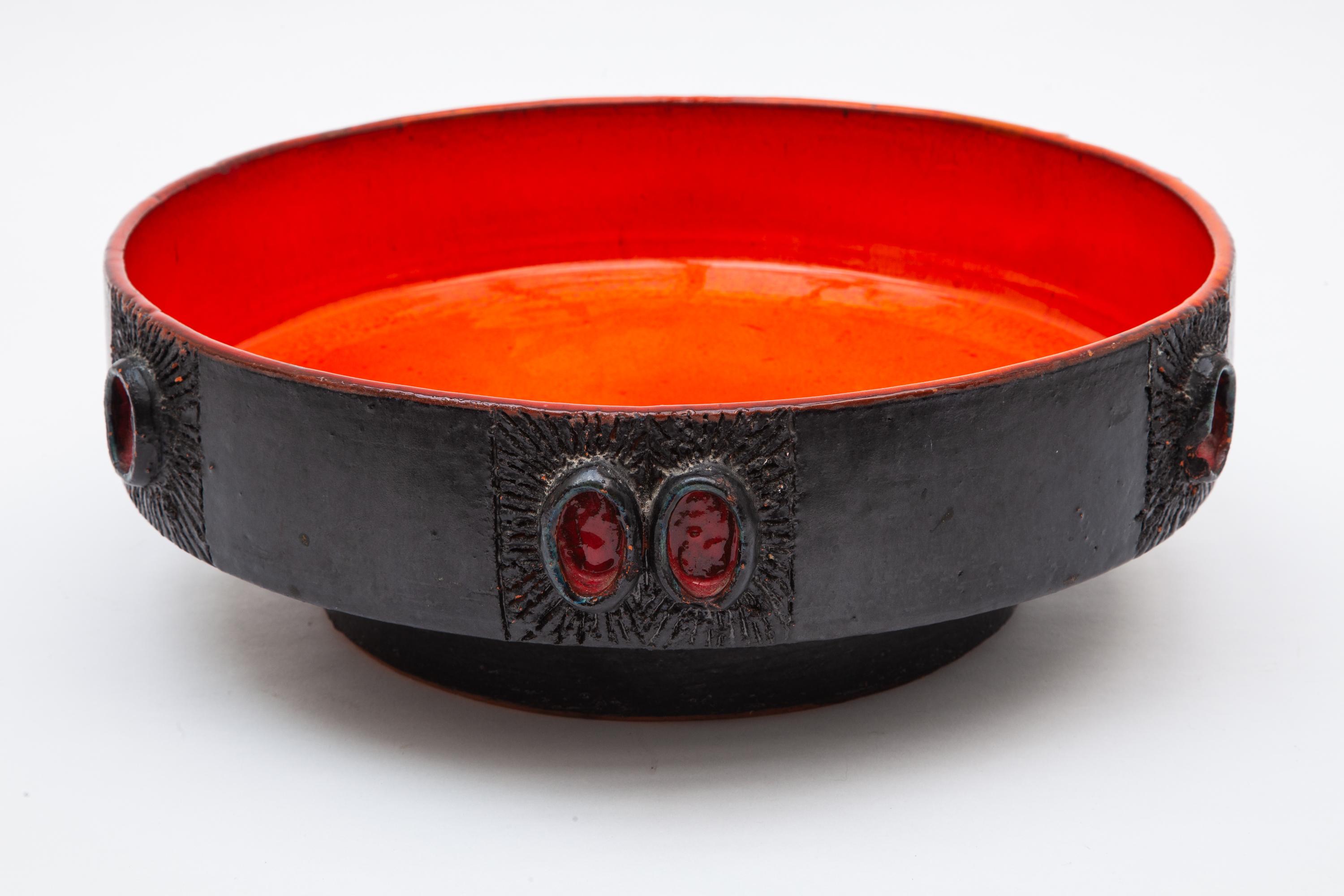 Amphora ceramic bowl, 1960s. Vibrant and glossy orange-red glaze paired with a deep black outer rim.
 
