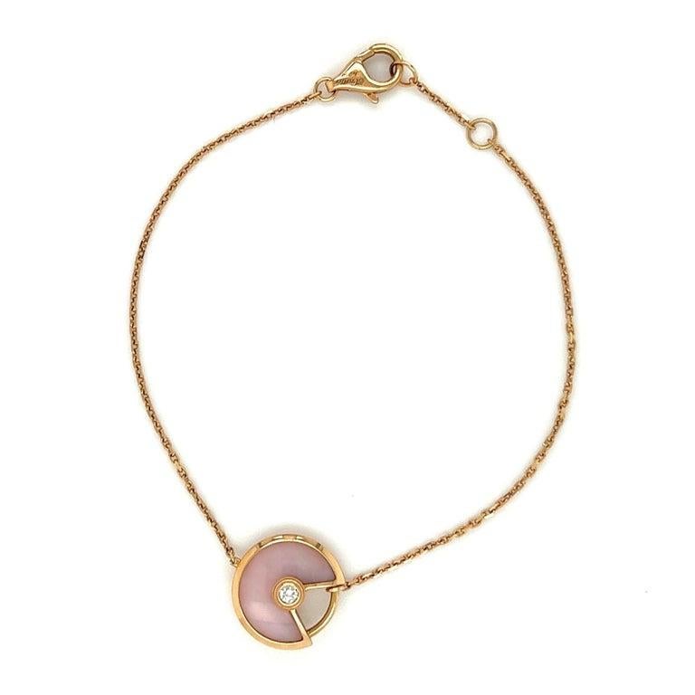 Simply Beautiful! Amulette de Cartier Pink Opal and Diamond Signed Gold Vintage Bracelet. Hand set with a Brilliant-cut Diamond weighing approx. 0.03 Carats. Hand crafted 18K rose Gold. Size Small, measuring 6.25