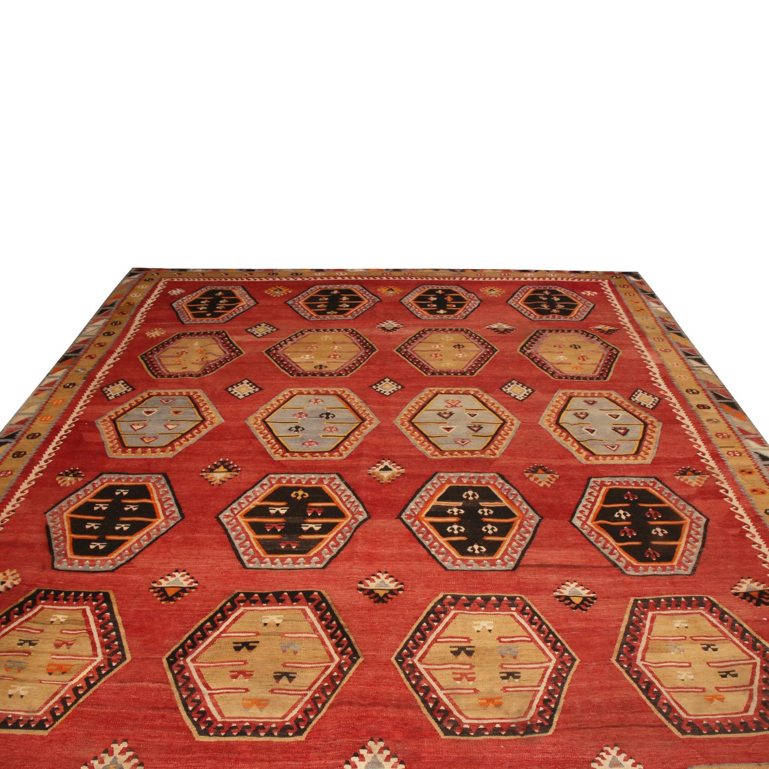 Originating from Turkey between 1950-1960, this vintage Anatolian wool Kilim rug enjoys an intriguing balance of lighter and richer colorways that has aged exceptionally well in this grounding portrait, featuring a tastefully abrashed burgundy red