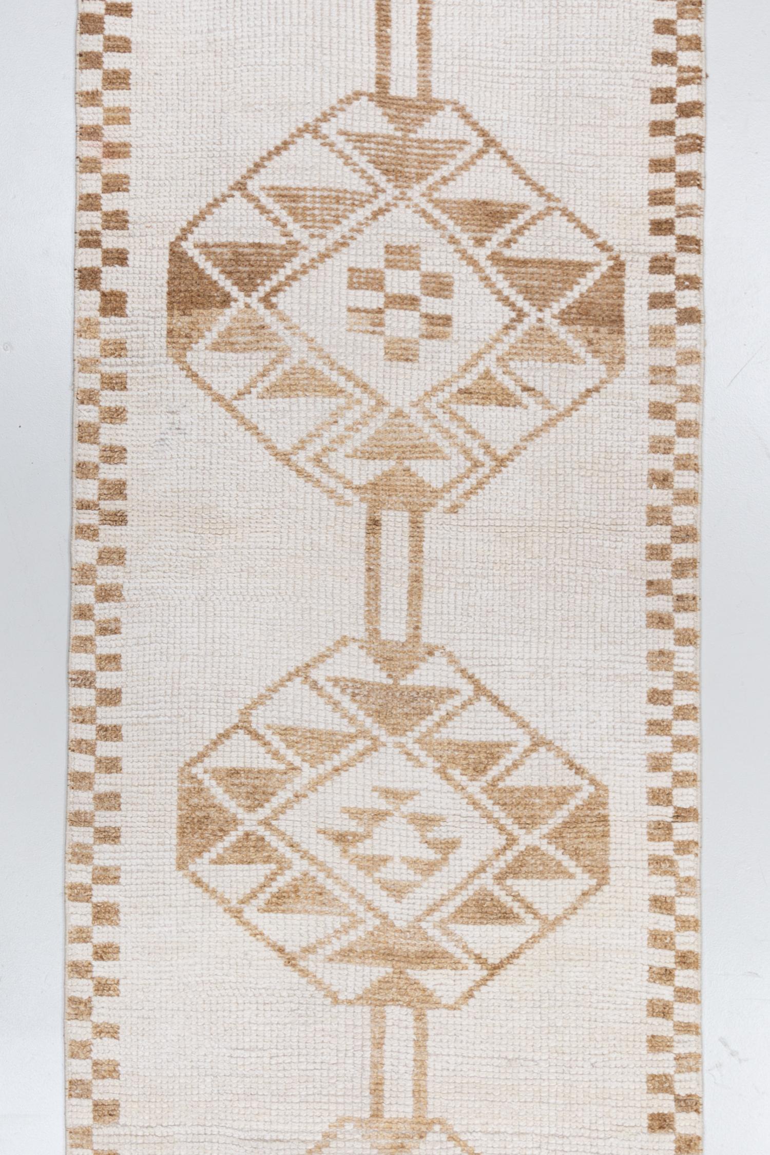 Wool on wool foundation with a soft pile, this vintage Turkish runner has a fun checkerboard border and great off white field. 

Wear Guide: 1

Wear Notes:
Vintage and antique rugs are by nature, pre-loved and may show evidence of their past.