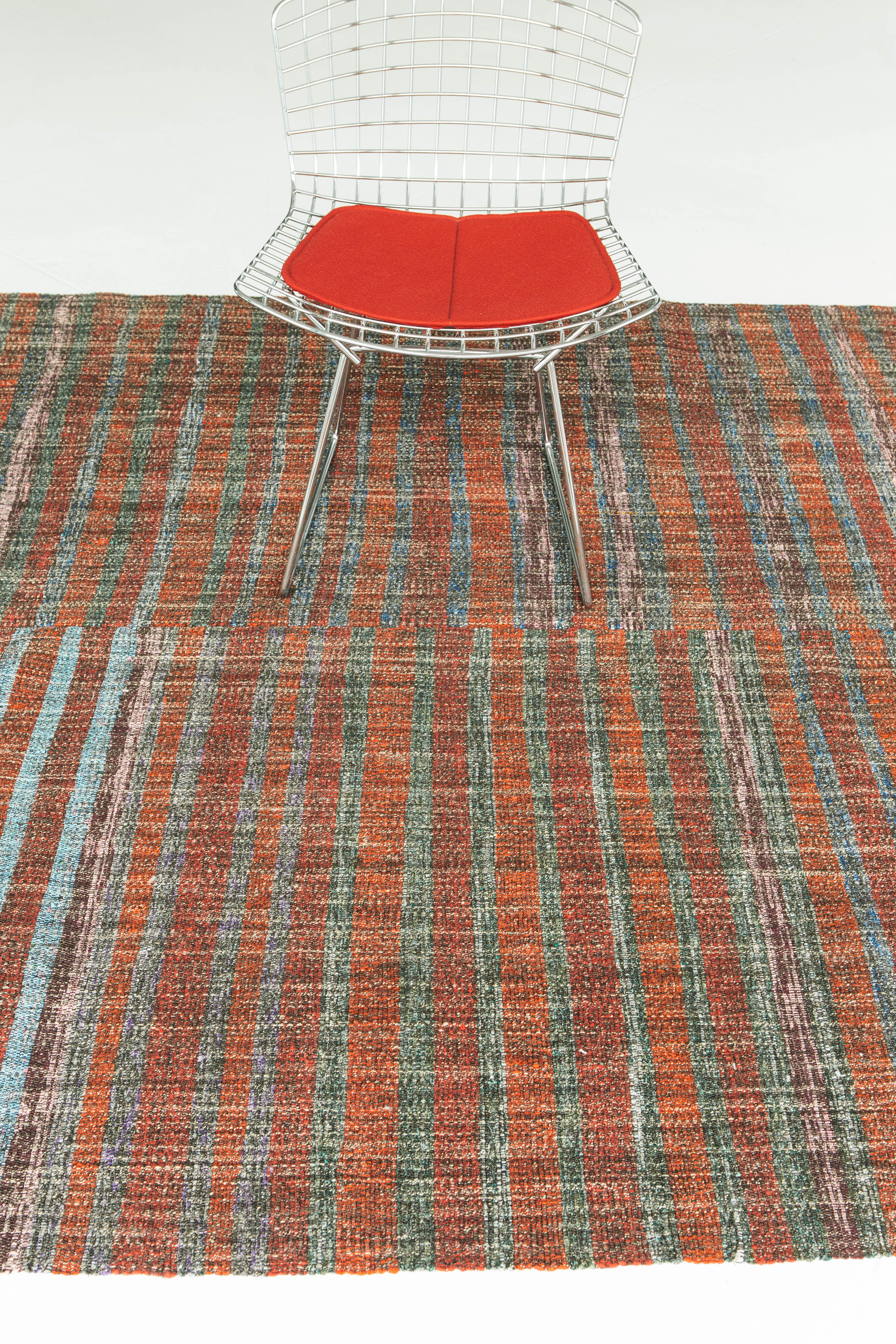 A multicolored vintage Anatolian Turkish flat-weave Kilim with a gorgeous autumnal orange tone and blue and green stripe detailing. This antique wool piece weaves together dyes and colors, motifs, textures and techniques that are popular in Anatolia
