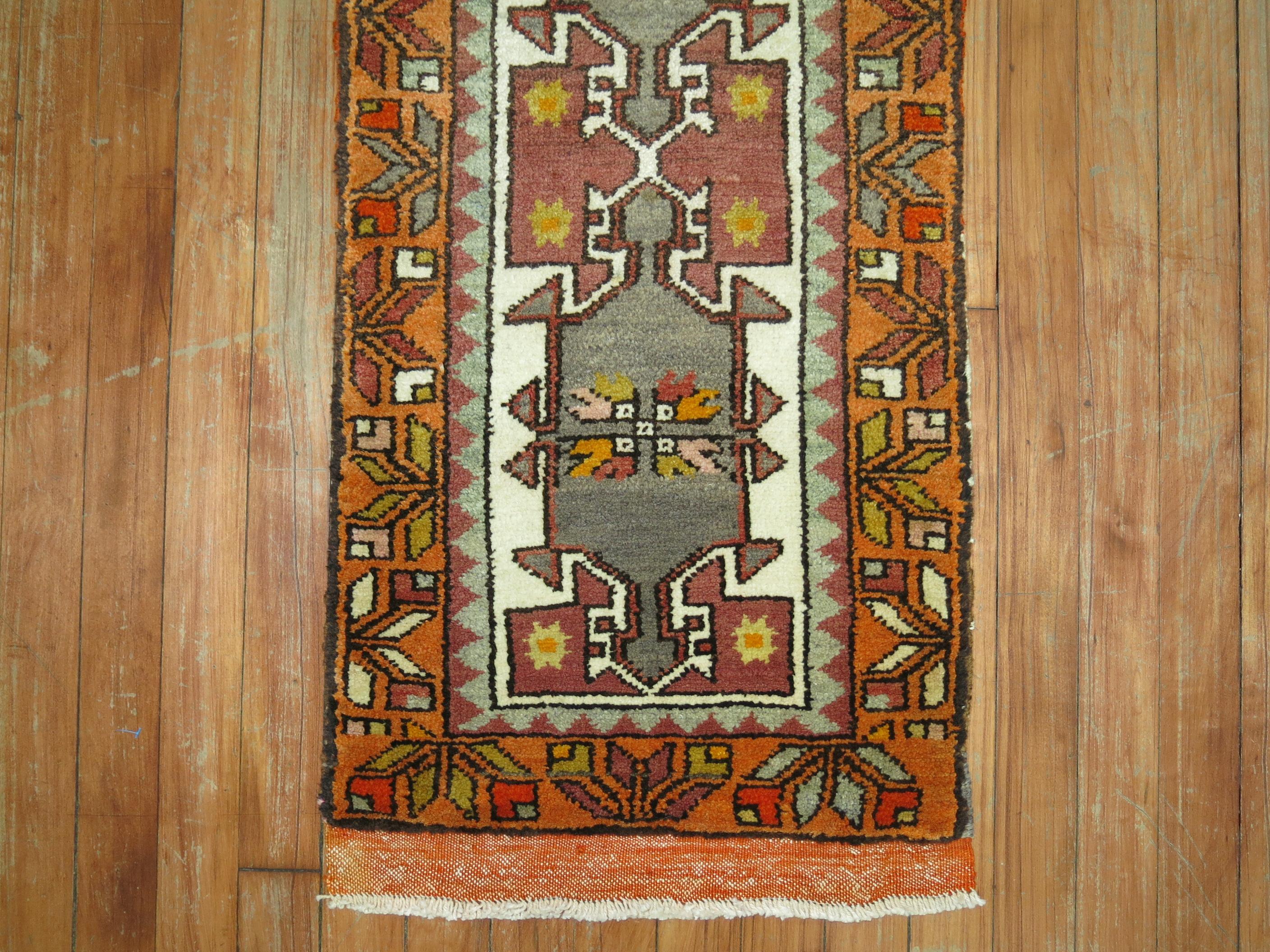 A vintage Anatolian Turkish Yastik rug mat with a double gray color medallion design on an ivory ground surrounded by an orange border. Full Pile Condition

1'5'' x 3'1''