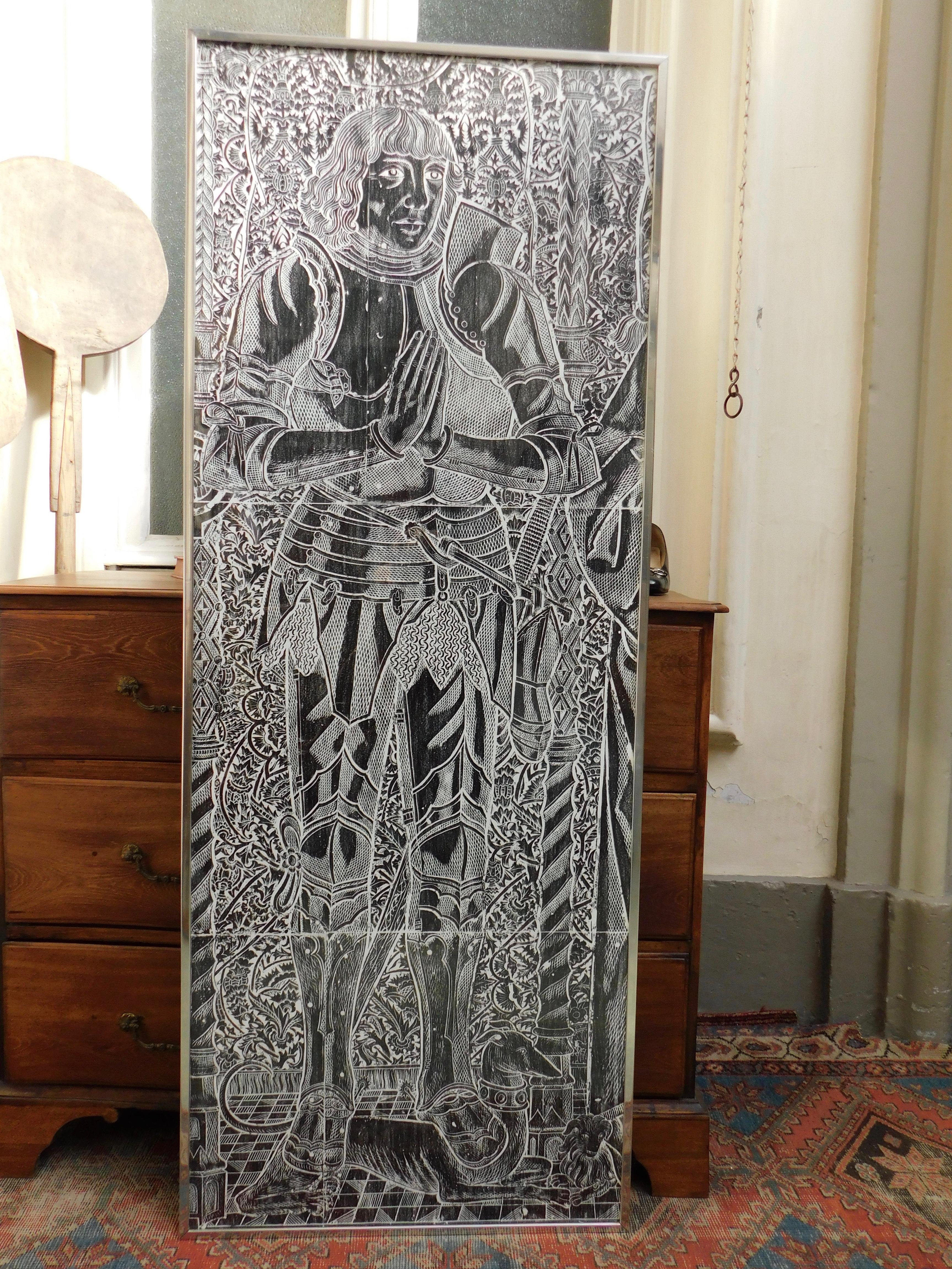 Over 5' tall wax rubbing on paper of a 13th century English tomb carving on stone.
Particularly popular in the 1970s tomb rubbings are made by laying paper on a tomb and rubbing with a flat piece of colored wax. This is a process that is much more