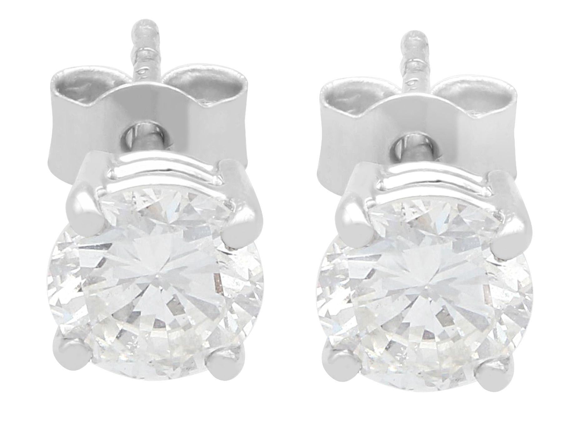 A stunning, fine and impressive pair of vintage and contemporary 1.41 carat diamond and platinum stud earrings; part of our diverse diamond jewelry and estate jewelry collections.

These stunning, fine and impressive diamond stud earrings have been