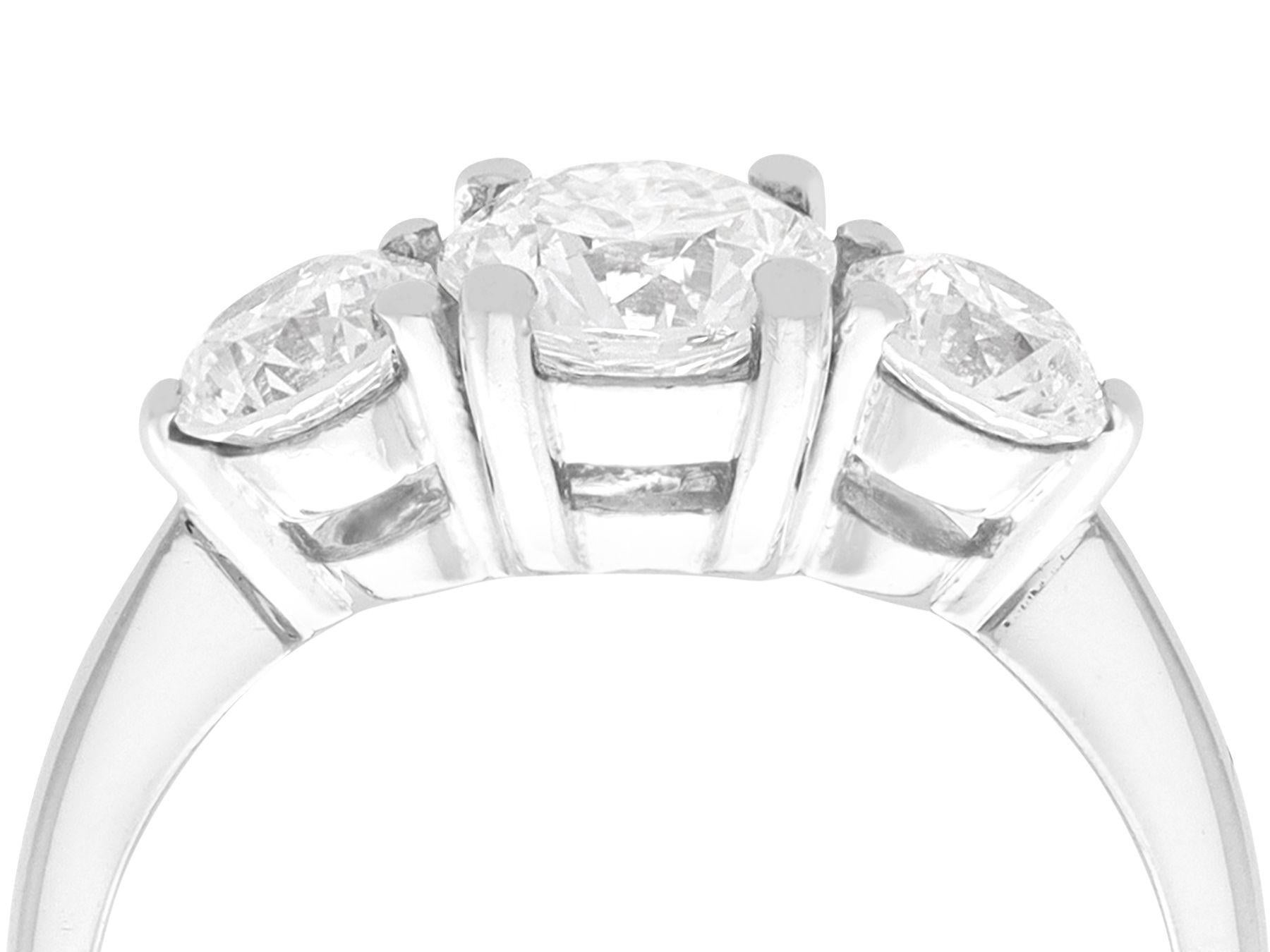 A stunning, fine and impressive contemporary platinum trilogy ring set with 1.81 carats of vintage (circa 1940) diamonds; part of our diverse diamond jewellery and estate jewelry collections.

This stunning, fine and impressive diamond trilogy ring