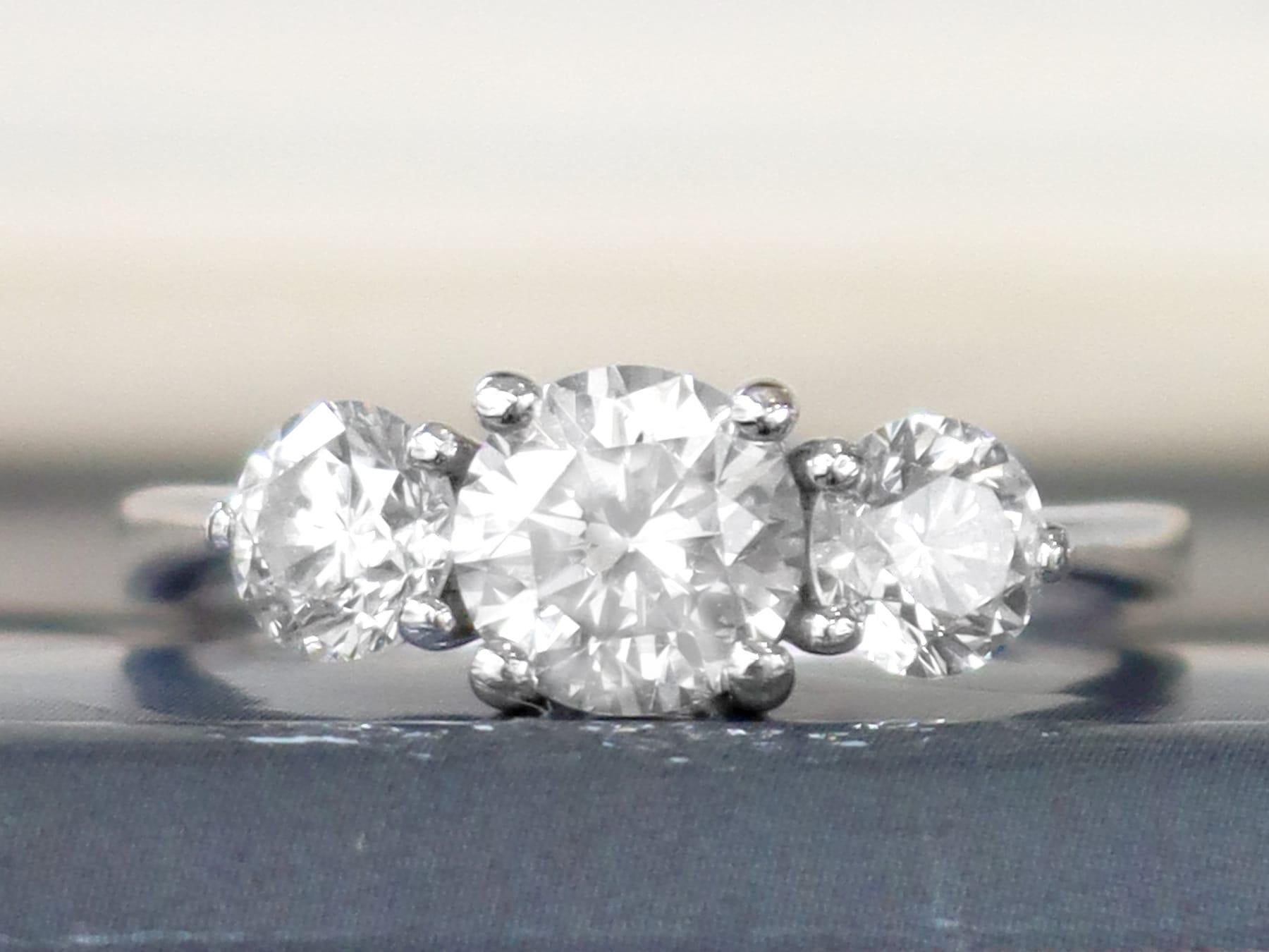 A stunning, fine and impressive contemporary platinum trilogy ring set with 1.81 carats of vintage (circa 1940) diamonds; part of our diverse diamond jewellery and estate jewelry collections.

This stunning, fine and impressive diamond trilogy ring