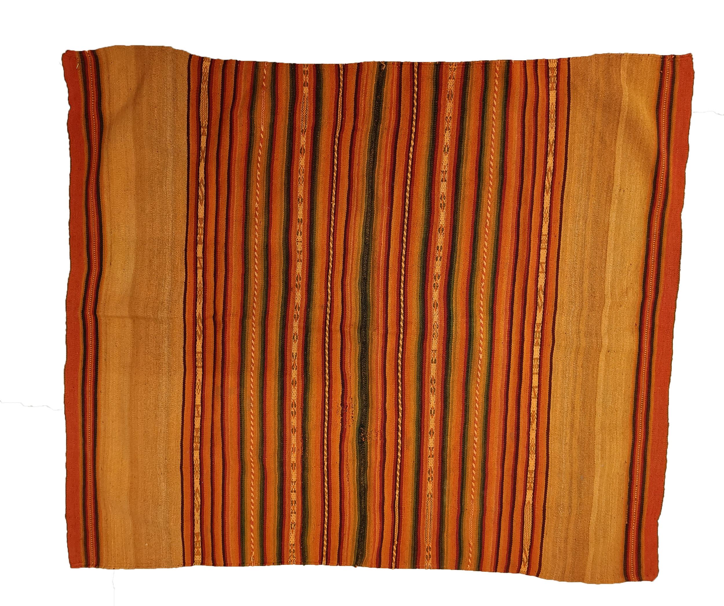 Vintage Andean Peruvian Manta Cloth South American Vintage Textiles.
A very fine Vintage Manta in ochre colours from the High Andes region of Peru Woven in came-lid fibre (Llama wool )beautifully executed in natural dyed colours 
Fine condition,