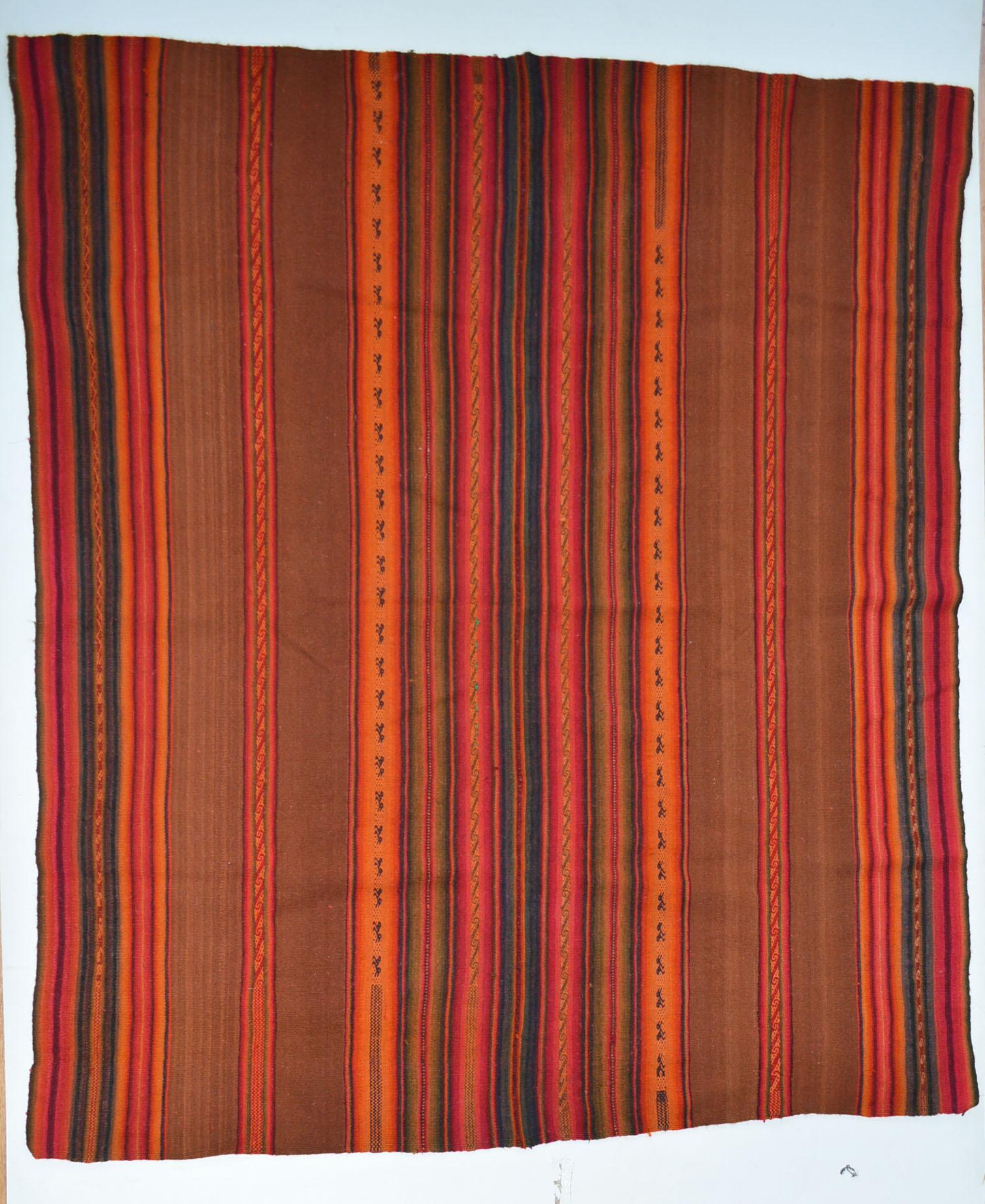 Vintage Andean Peruvian Manta Cloth South American Vintage Textiles.
A very fine Vintage Manta cloth from the High Andes region of Peru Woven in came-lid fibre (Llama wool )beautifully executed in natural dyed colors 
Fine condition, Period 1950's