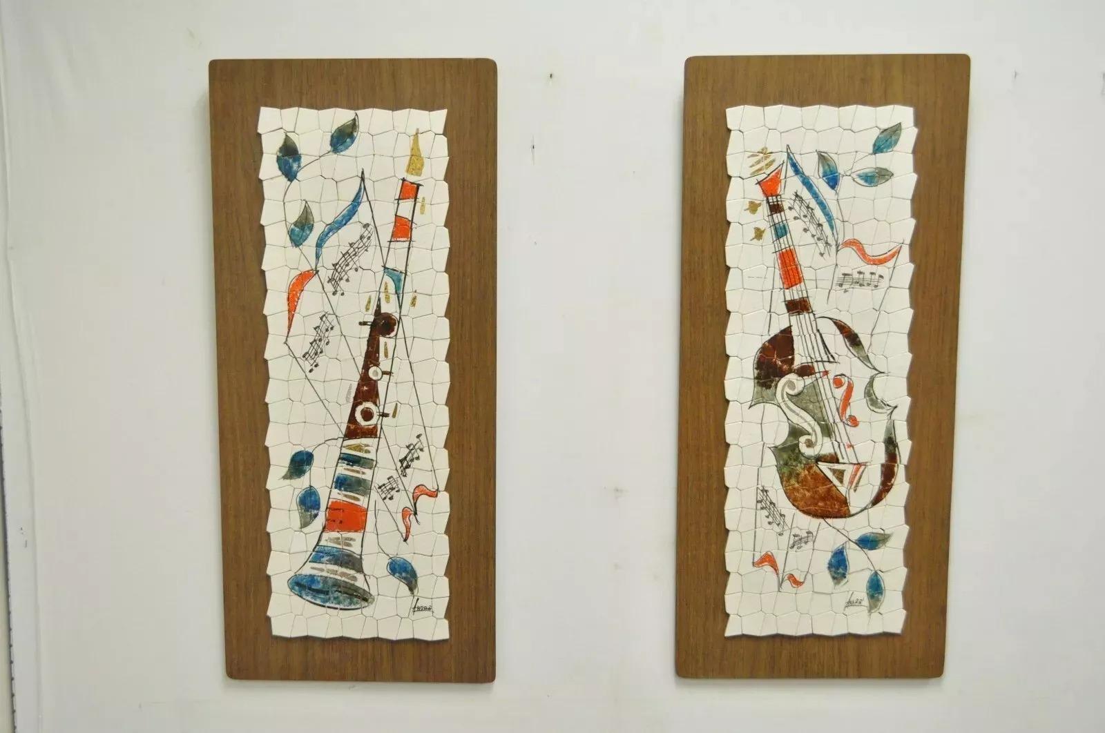 Pair Vintage Andre Mid Century Modernist Abstract Music Instrument Tile Wall Art. Item features mosaic tile, pained clarinet and violin/cello, mounted on laminate surface with wood backing. Signed 