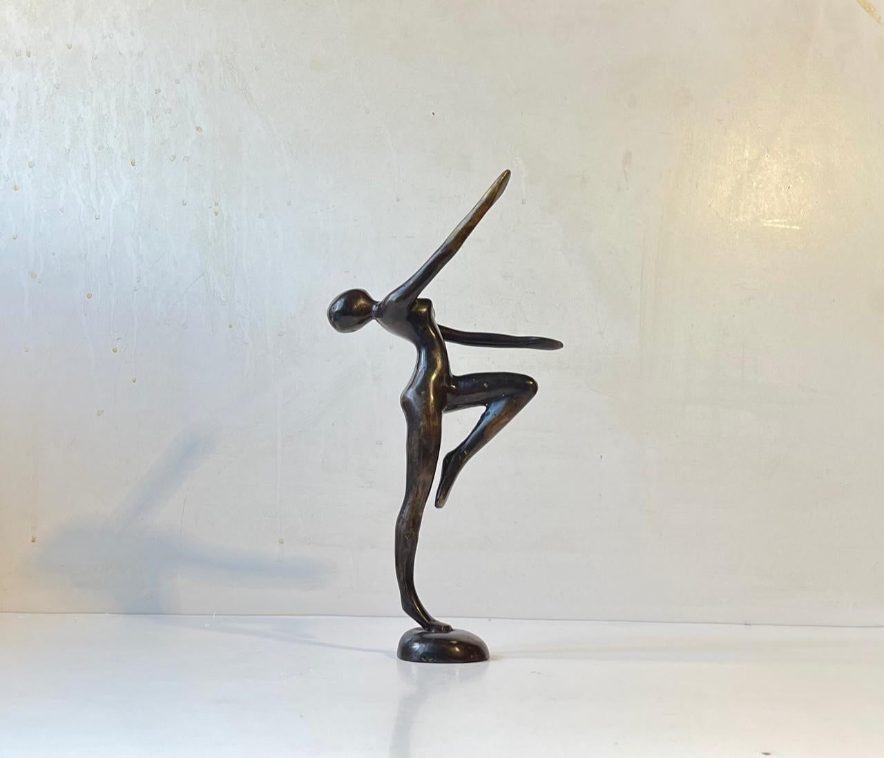 Unusual androgynous sculpture in patinated bronze. Female body and expression-blank facial features. Unknown Scandinavian maker circa 1970. No markings/signature. Measurements: H: 29 cm, W: 15 cm, D: 6 cm.