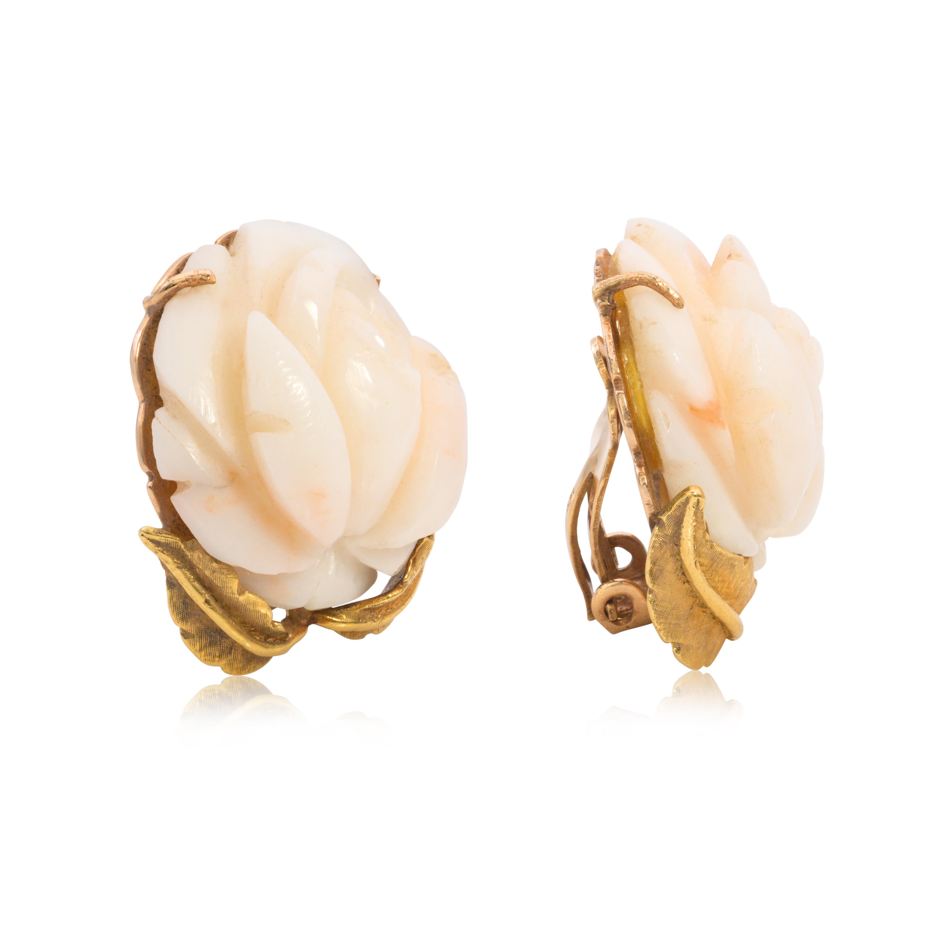 A vintage pair of fashion earrings, featuring angel skin carved coral. Finely made with 14K yellow gold. Perfect for formal wear.

Available in a matching bracelet. Please inquire about item TB794. 