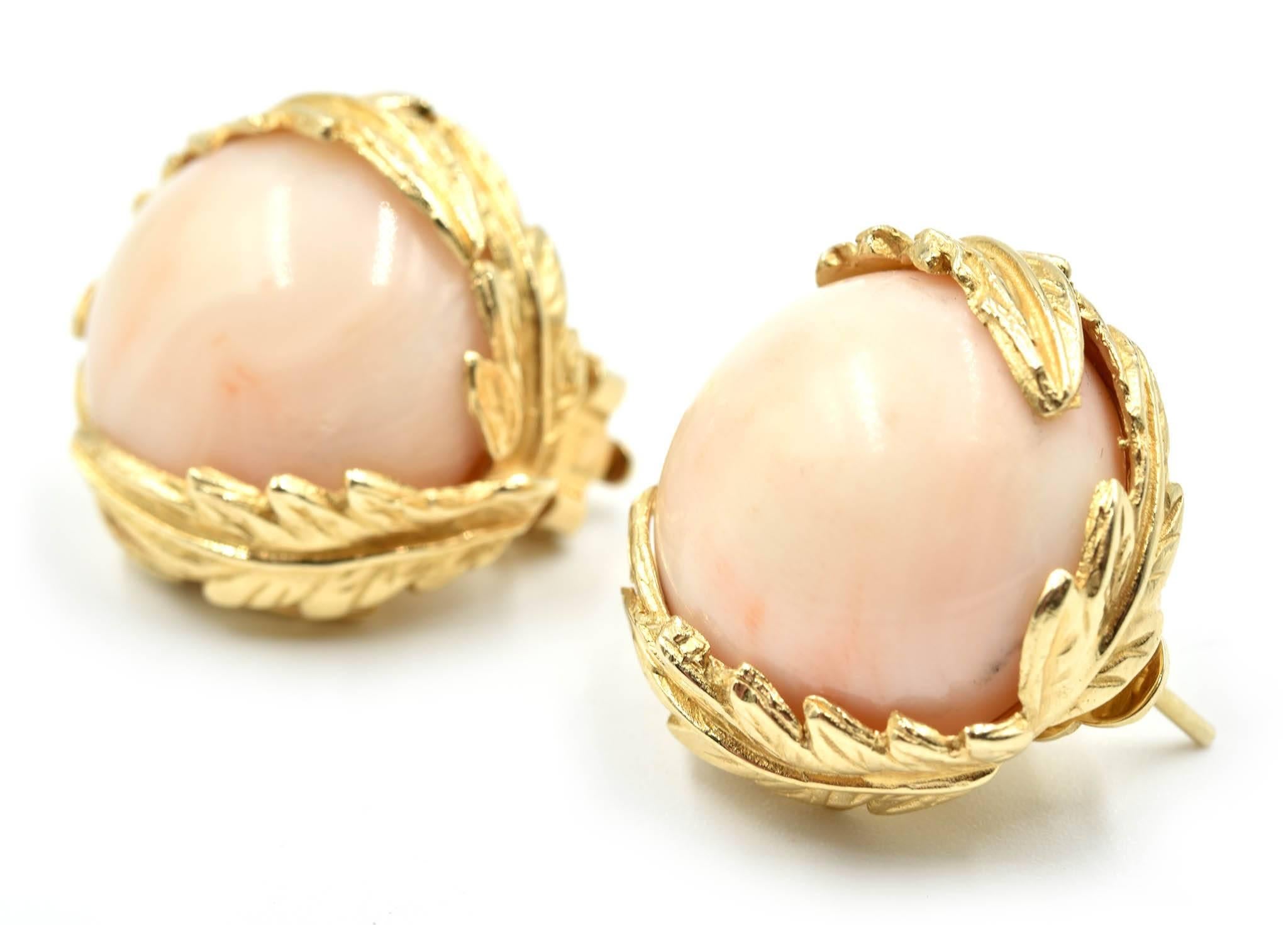 Designer: custom design
Material: 14k yellow gold
Coral: two semi round 18mm angel skin coral
Dimensions: each earring measures approximately 3/4th an inch long and ½ an inch wide
Fastenings: omega backs
Weight: 18.00 grams
