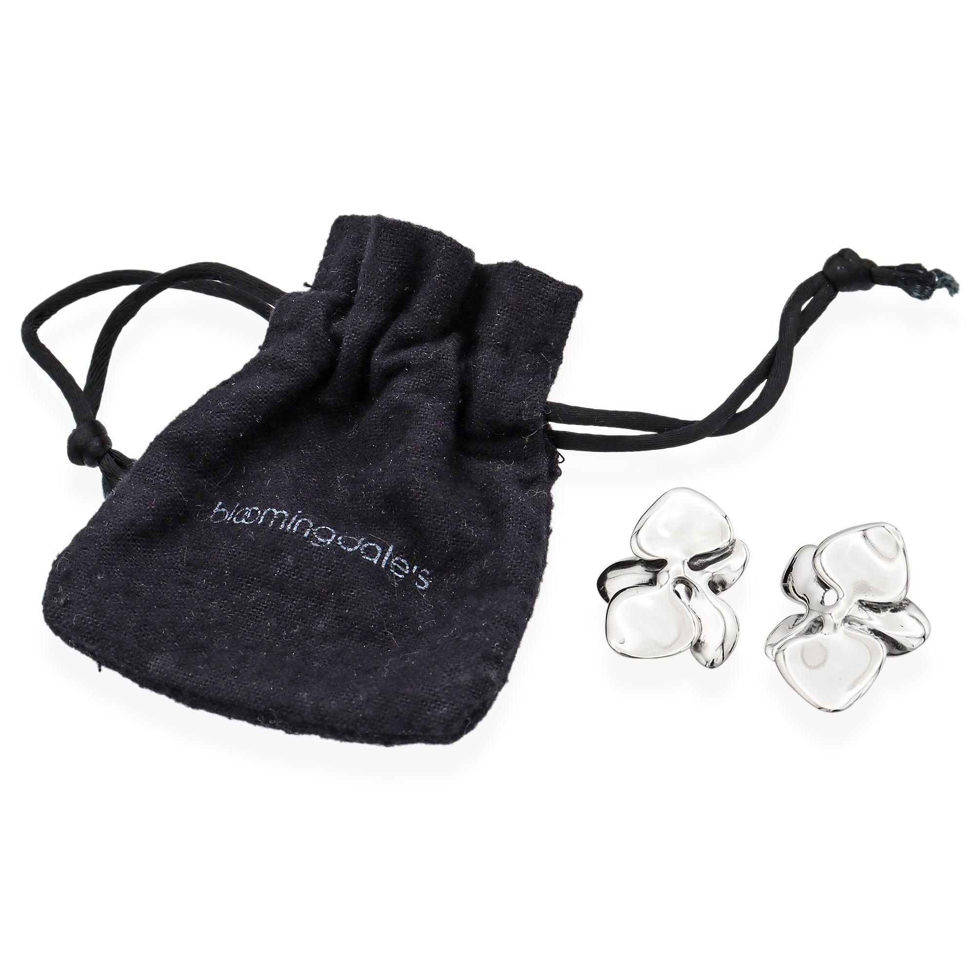 Sterling Silver Floral Earrings are a testament to refined elegance. These stunning earrings feature a fluid, organic design reminiscent of delicate petals in bloom. Expertly crafted, their smooth, polished surface captures light beautifully,