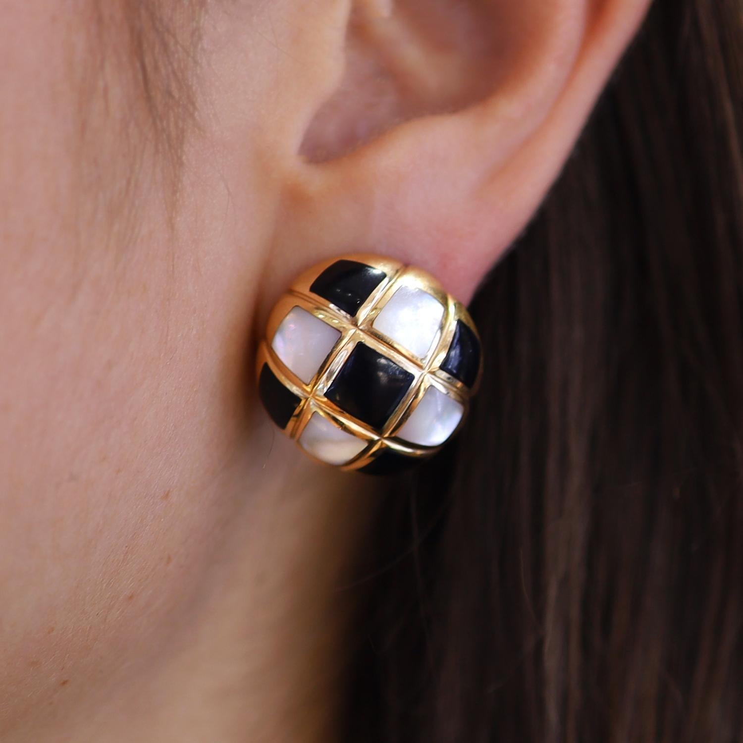 A smart checkerboard of onyx and mother of pearl delight in these chic button earrings by noted designers KABANA. This style was pioneered by Angela Cummings, a sleek and stylish black and white pattern that will pair with a multitude of styles. The