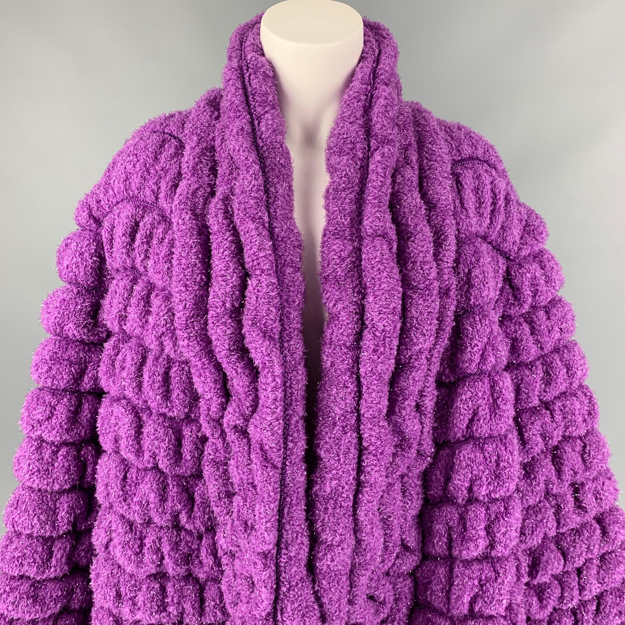 Vintage ANGELA MISSONI coat comes in a purple textured metallic material featuring a oversized fit, shawl collar, and a open front. 

Very Good Pre-Owned Condition. Fabric tag removed.
Marked: Size tag removed.

Measurements:

Shoulder: 18 in.
Bust: