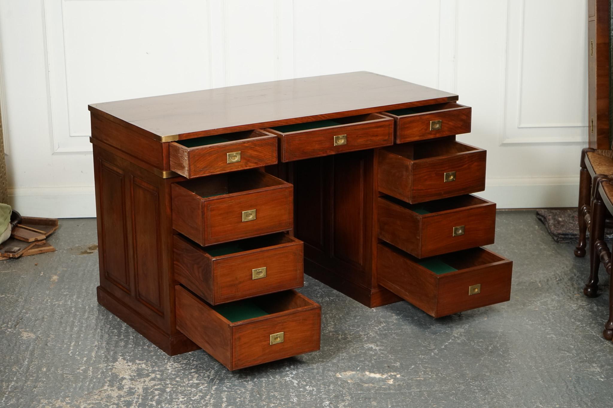 
We are delighted to offer for sale this Vintage Anglo Indian Brass Military Campaign Twin Pedestal Desk.

 A magnificent and unique piece of furniture that exudes charm and character. This desk is crafted from high-quality materials and features