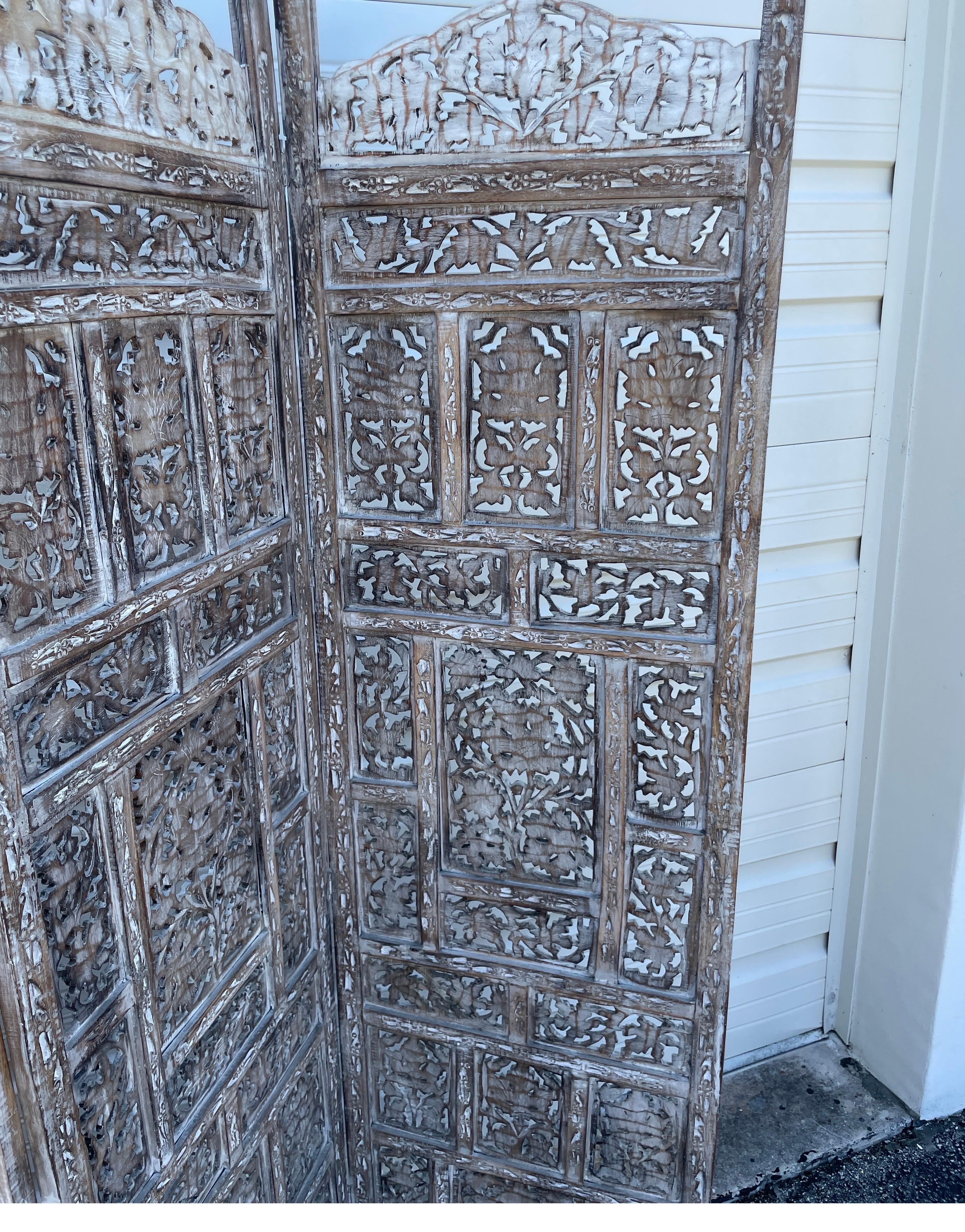 Vintage carved whitewashed four panel Anglo Indian folding screen. Each panel measures 20