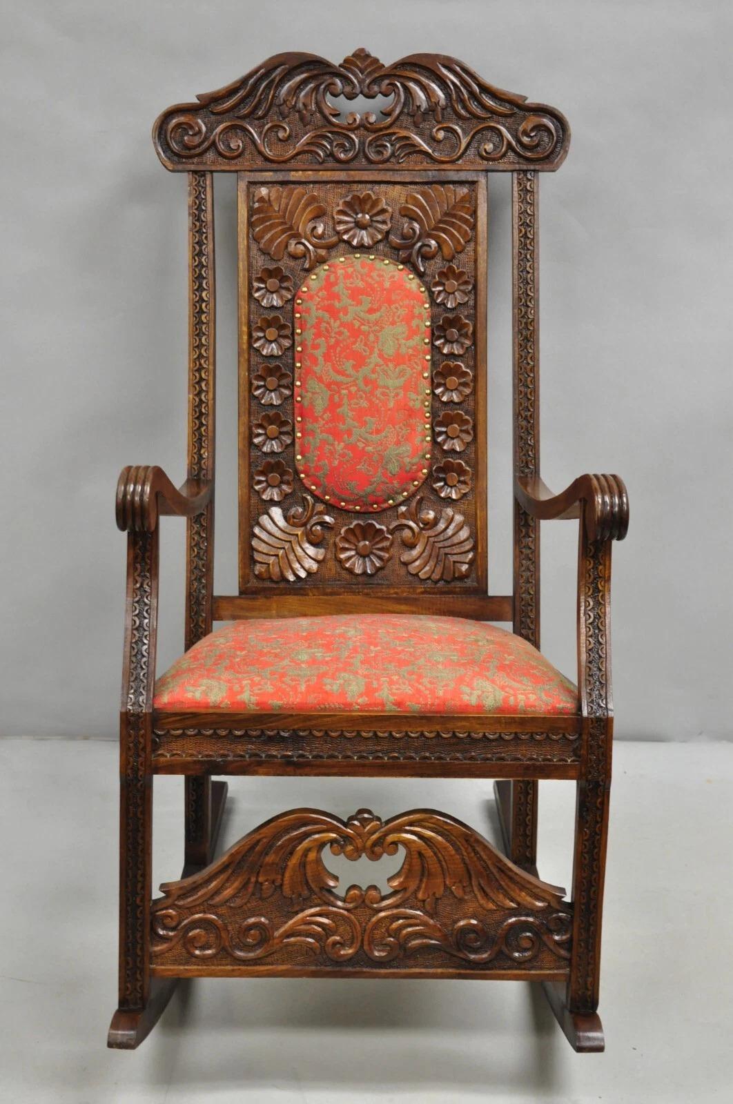 Vintage Anglo Indian Renaissance Style Ornate Carved Wood Upholstered Rocker Rocking Chair. Circa Mid 20th Century. Measurements: 43