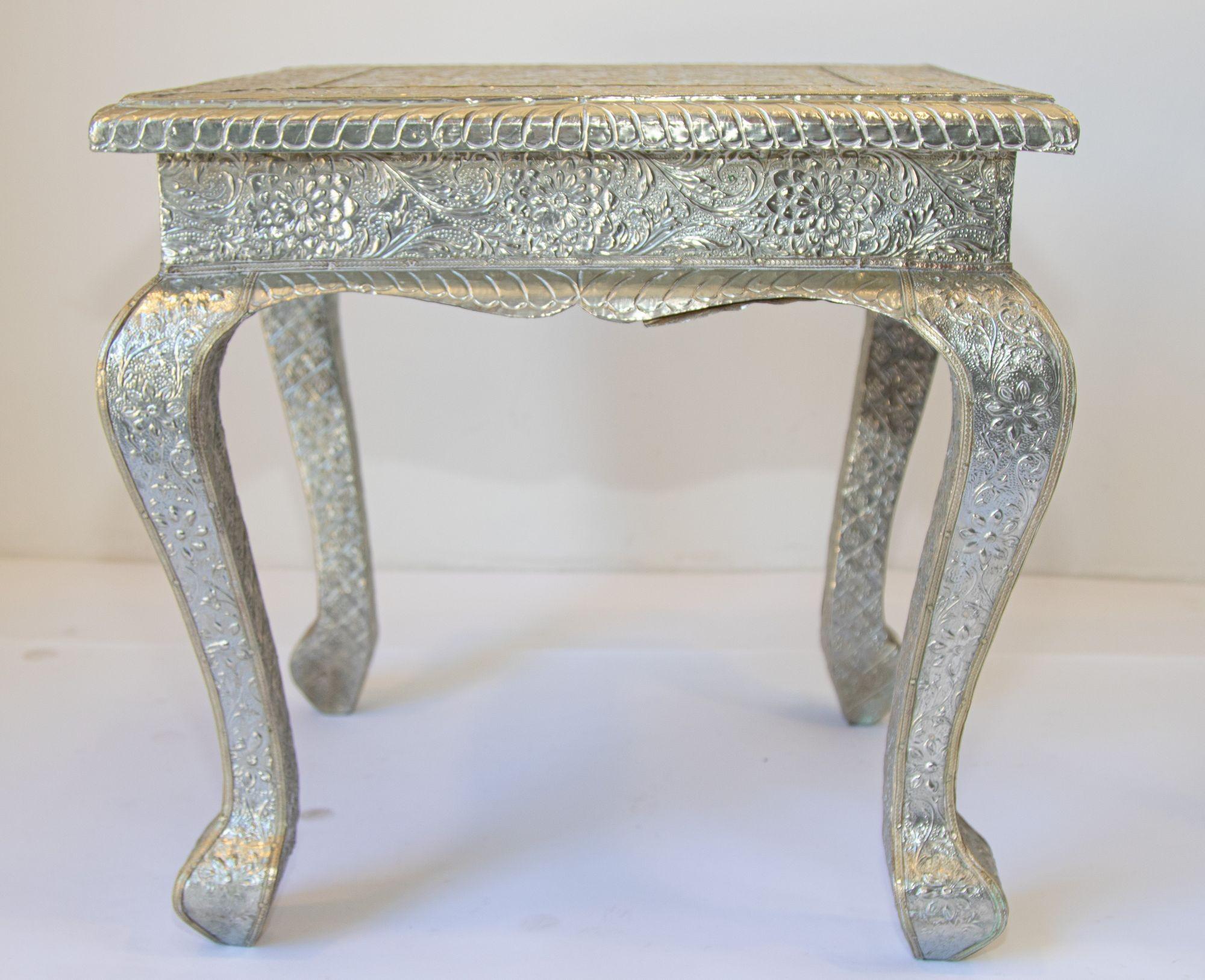 Vintage Anglo-Indian silvered wrapped clad side low table. Anglo Raj side low table hand-hammered with repousse silver metal work over wood very nice and unusual. Great vintage Anglo-Indian silver metal clad square table. This versatile table can be