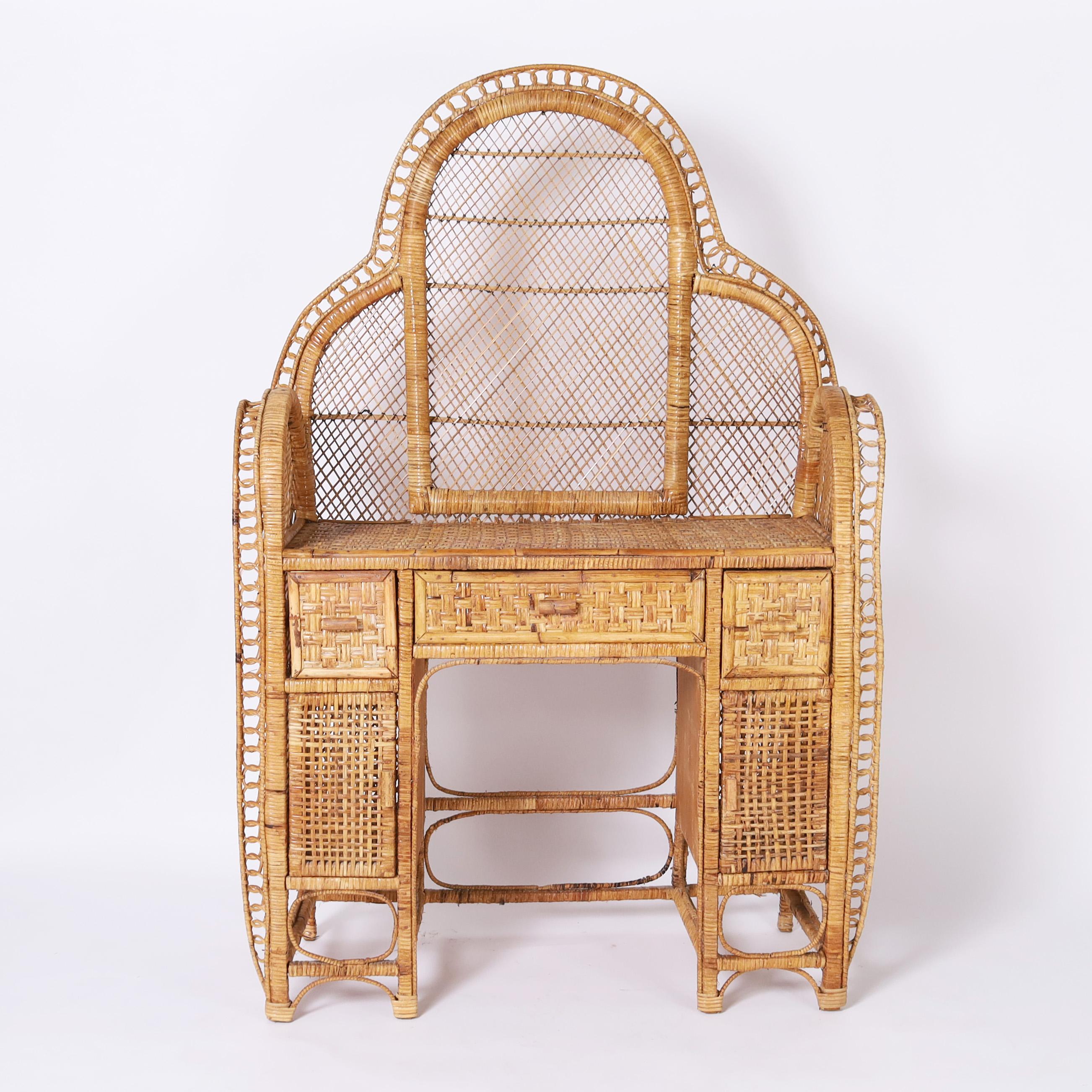 Rare and unusual vintage Anglo Indian vanity handcrafted in a stylized peacock form with wicker sides and back having a woven rattan top, drawers fronts, and cabinet doors. 

Kneehole measures 23