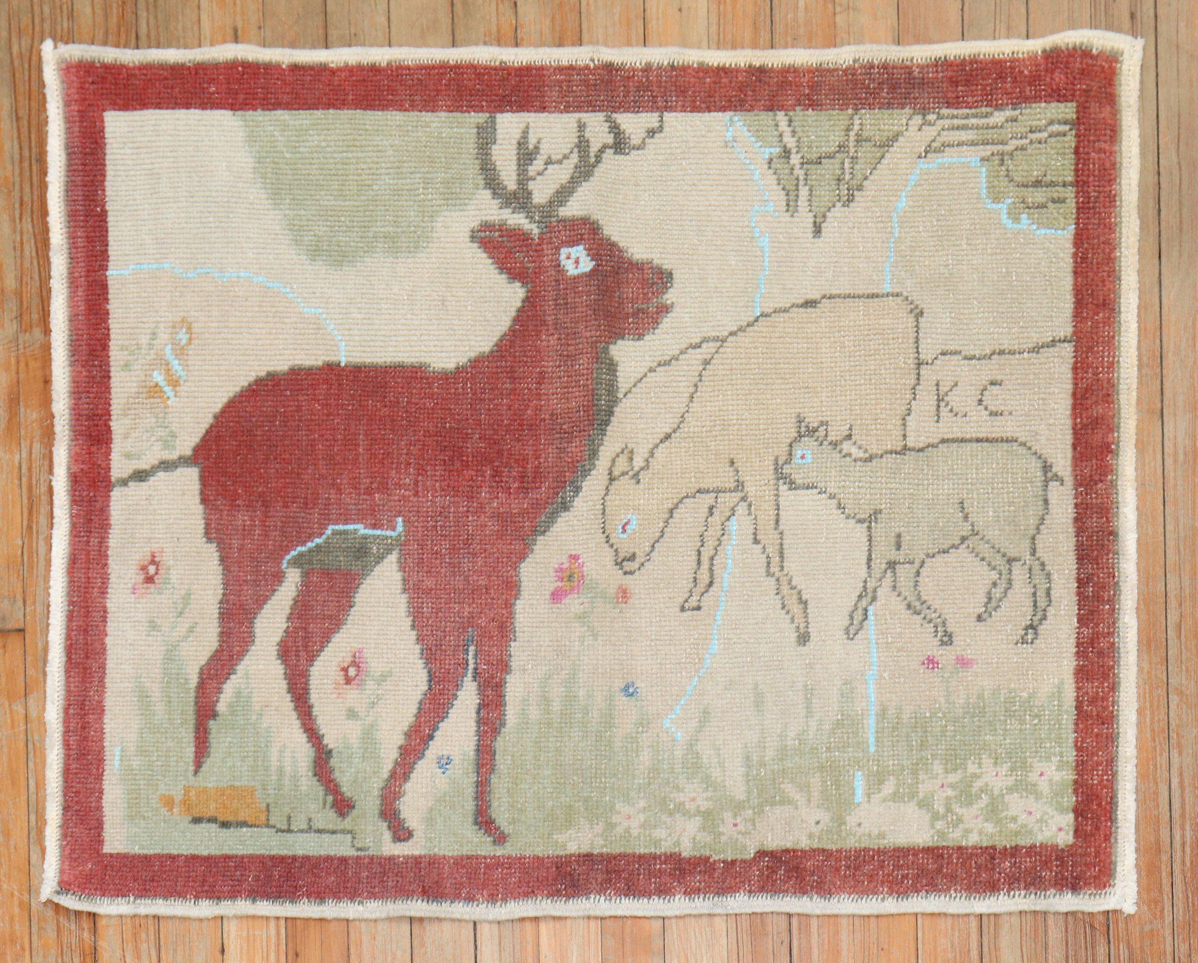 Mid-20th Century Turkish Rug depicting a Deer and 2 goats. Initialed KC, probably 1st letter of first and last name of the weaver

Measures: 2'7'' x 3'3''.