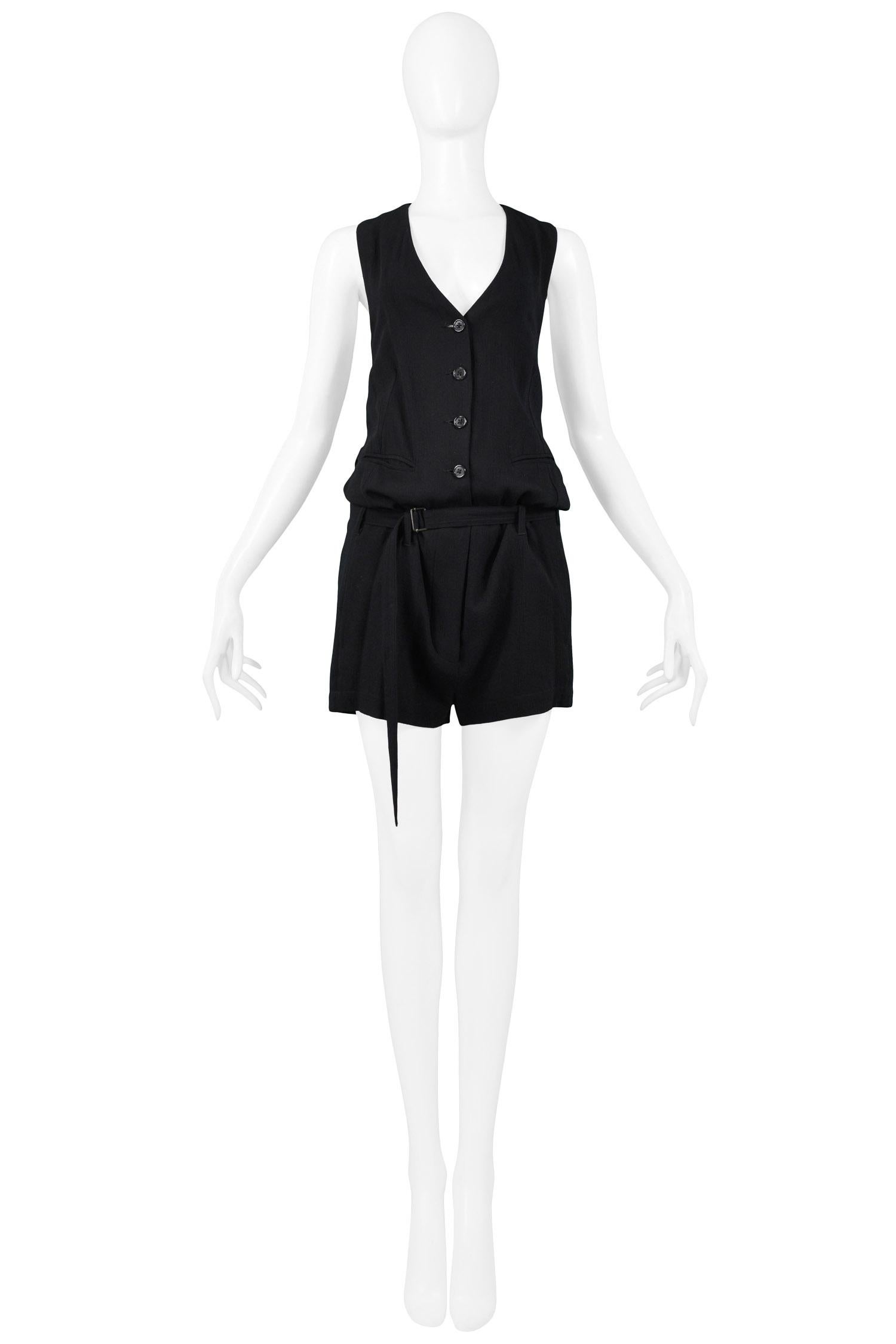 Vintage Ann Demeulemeester black sleeveless v-neck romper with buttons down center front, two front pockets and one back pocket, and adjustable straps at waist and at back.

Excellent Vintage Condition.

Size 36