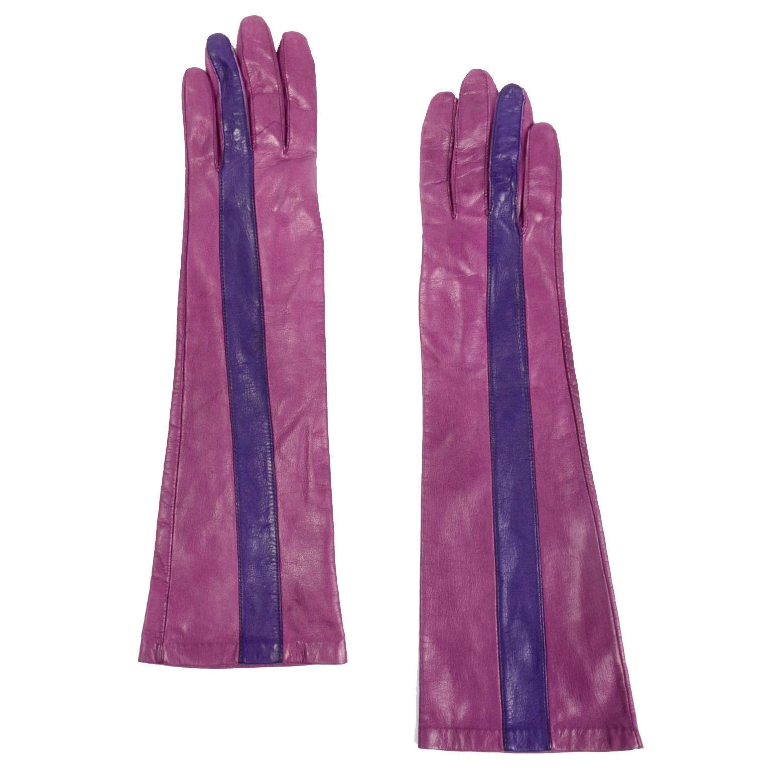 We love unique vintage gloves and these are incredible Anne Klein purple and pink leather gloves! These gloves are in a gorgeous shade of magenta pink with a dark purple stripe that starts at the tip of the ring finger and extends until the end of