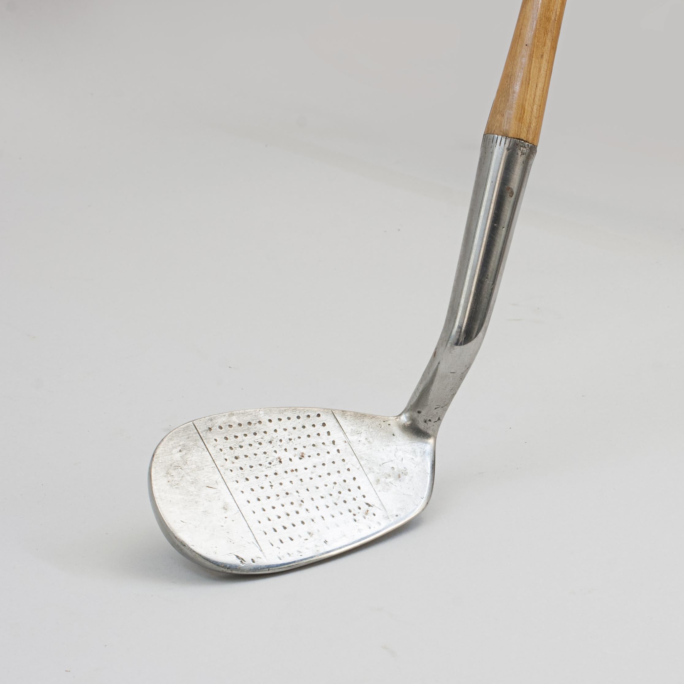 Mashie-Niblick golf club by Gibson of Kinghorn.
A good Mashie-Niblick iron (Smith's model) made by Gibson of Kinghorn with a hickory shaft and suede leather grip. The head with hand punched dot face markings and the rear clearly stamped with the