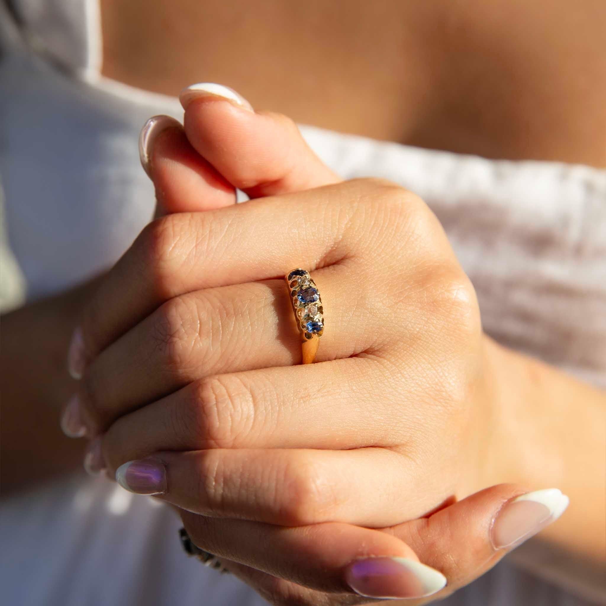 Sweetly crafted in 18 carat gold, The Janice Ring is a vintage joy. Her intricate London Bridge setting holds three royal blue sapphires and two sparkling diamonds. From another time and place, she has found her way to us and to you.

The Janice