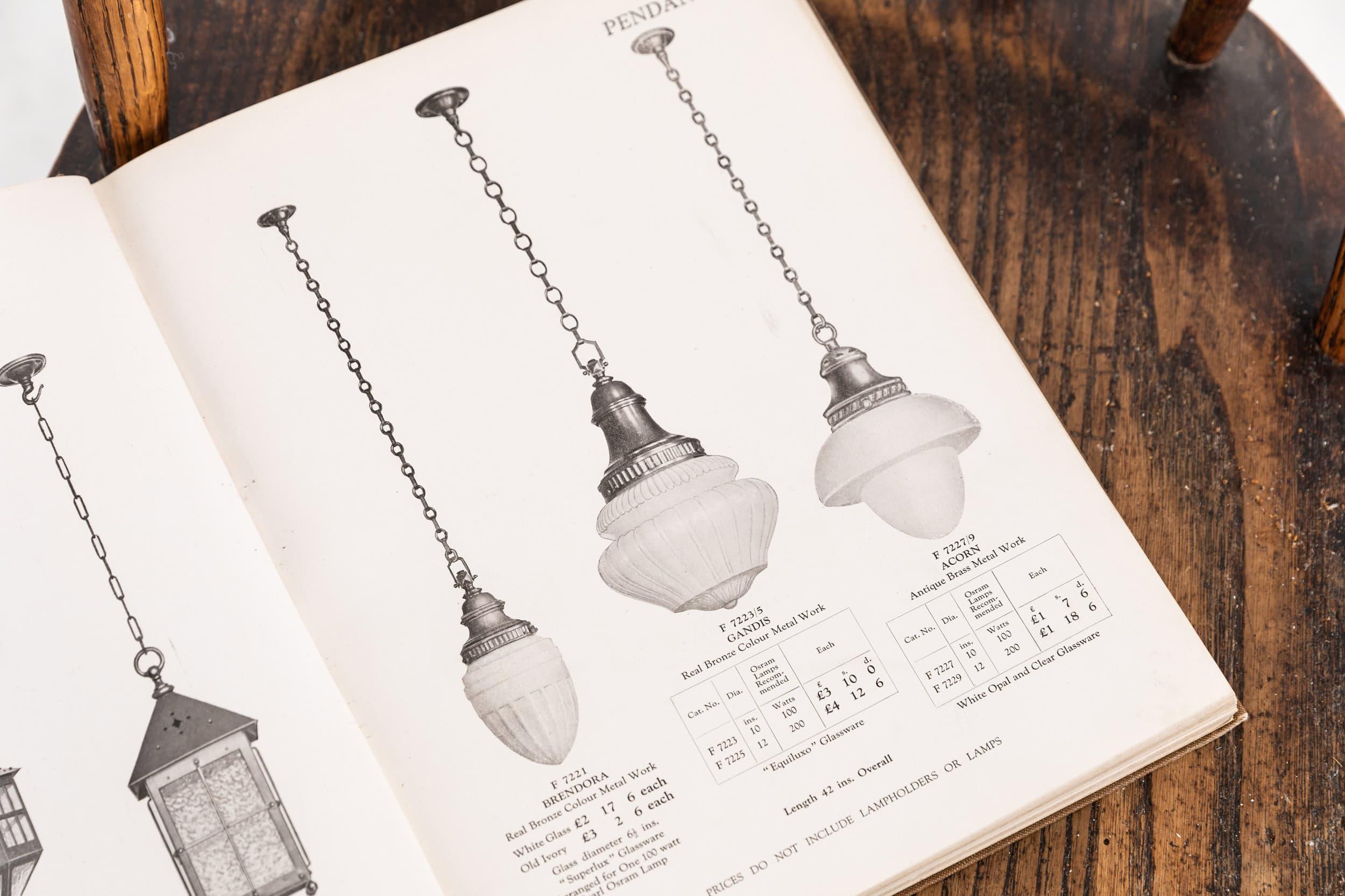 

An incredibly elegant glass pendant light made in England by General Electric Company - GEC. c.1930

Opaline glass shade of pressed form, with its original cast brass gallery, as shown in an original catalogue from 1935. An all round superb lamp
