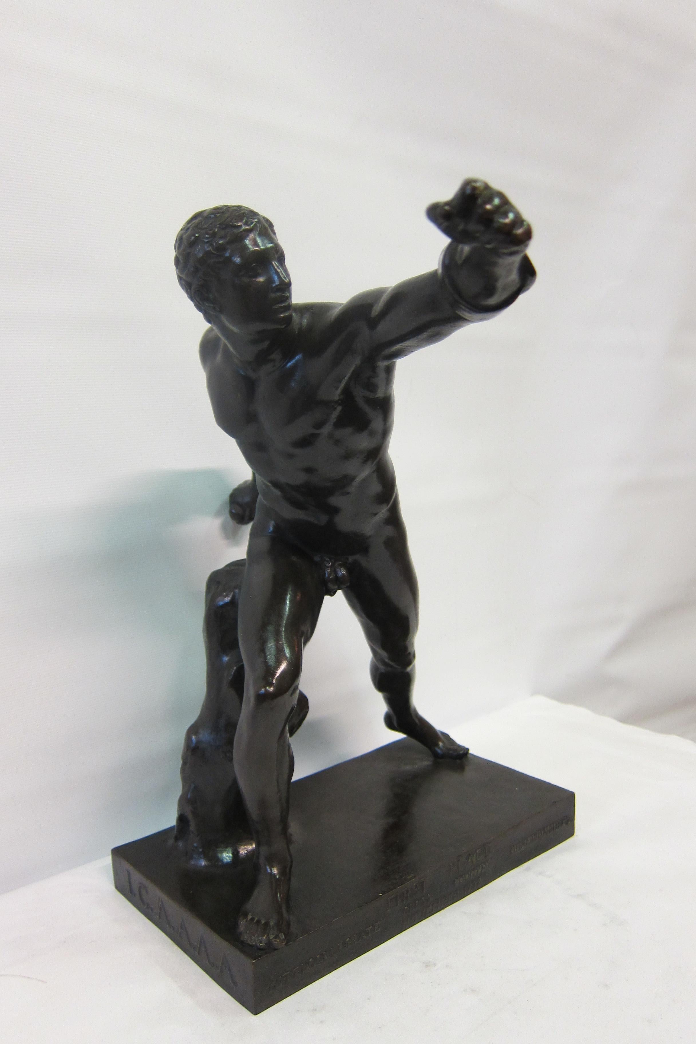 This wonderful vintage patinated bronze dates from the late 19th century. Its subject is a well defined Classical nude male athlete posed in lunging position. The statue was created for the Funeral games of Patroclus. It is unsigned.
Stunning!
  
