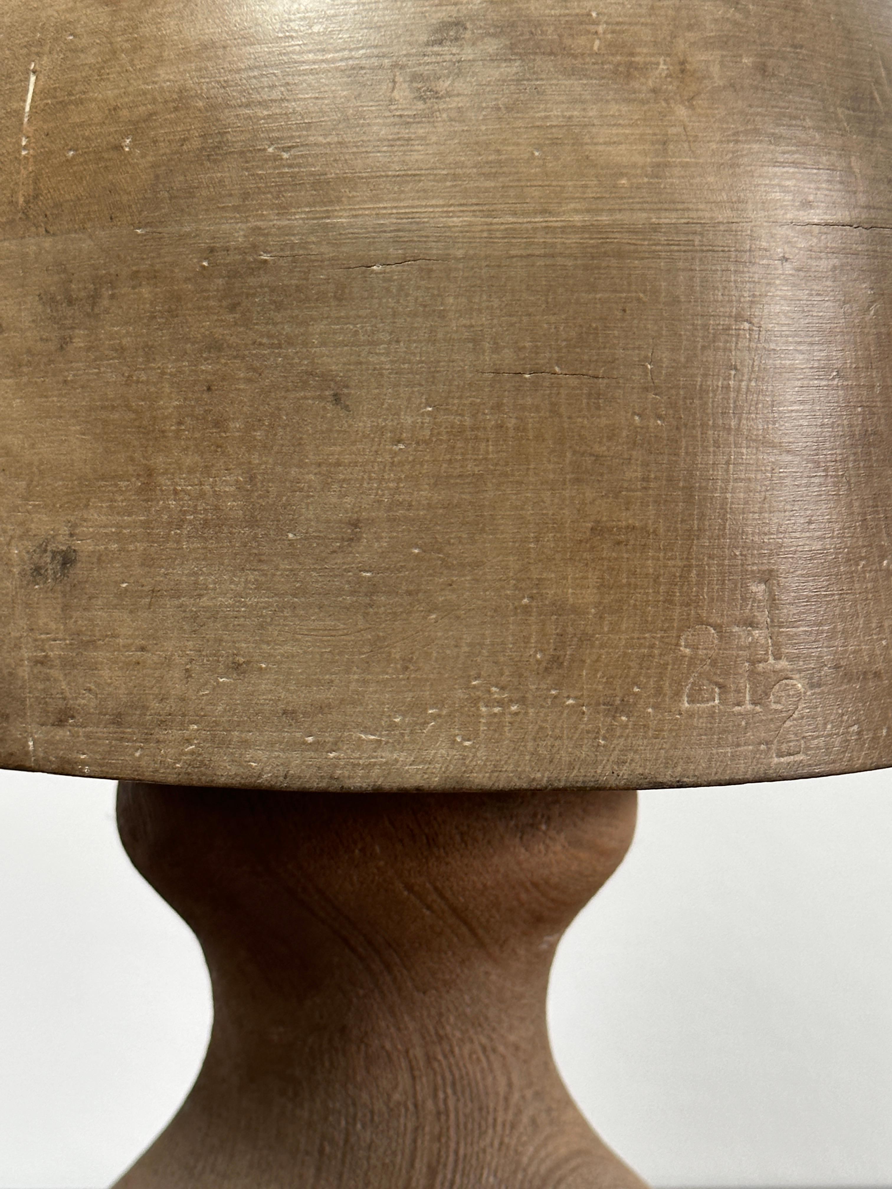 - An original vintage wooden round millinery hat block with removable stand, England Circa 1950.
- This block has been recently waxed and left in its natural colour, comes with its original removable stand.
-  Beautiful decorative piece which was