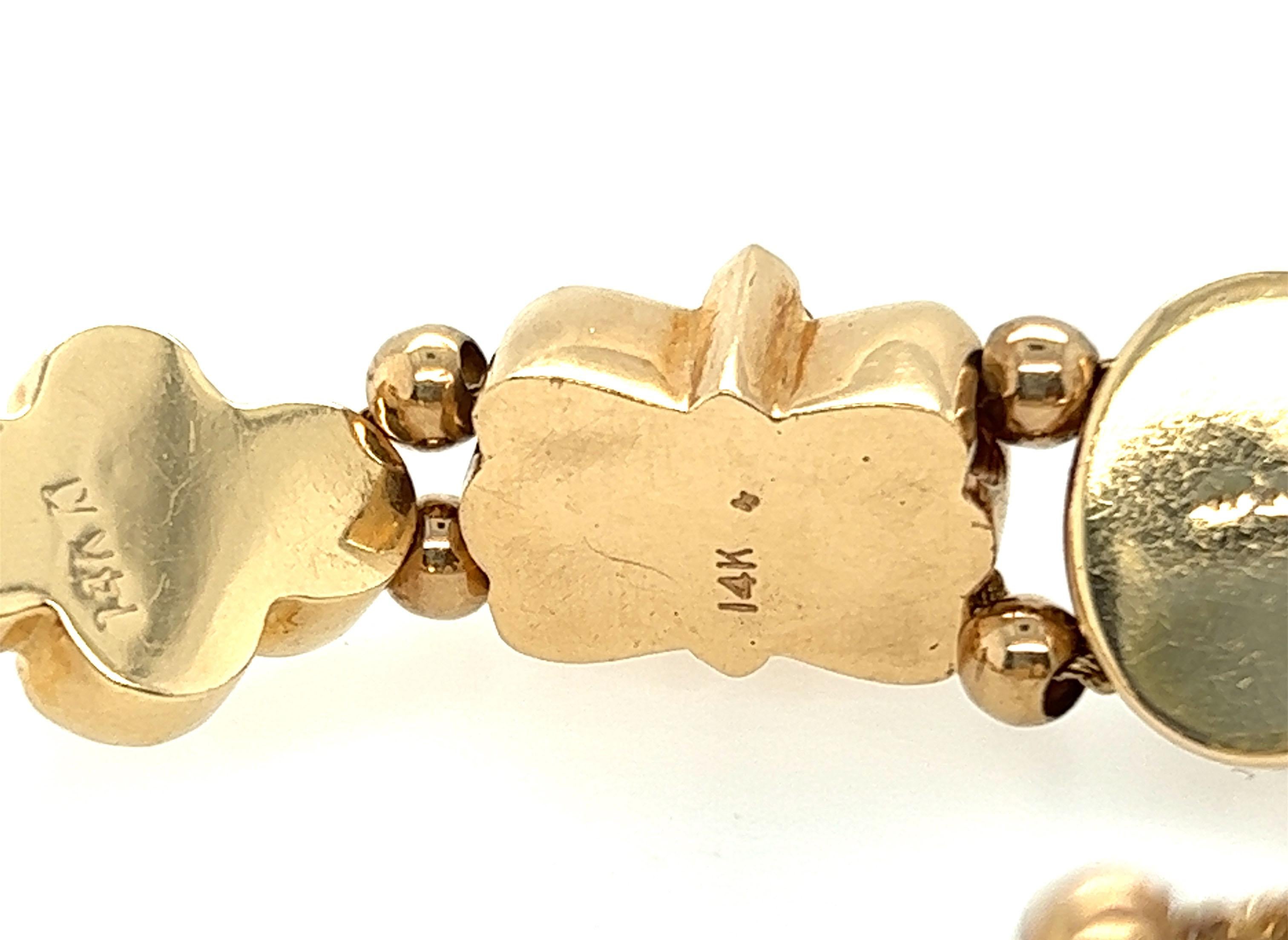 Antikes Original Slide Charm-Armband aus 14 Karat Gelbgold mit Edelsteinen, Vintage, 1949 Damen