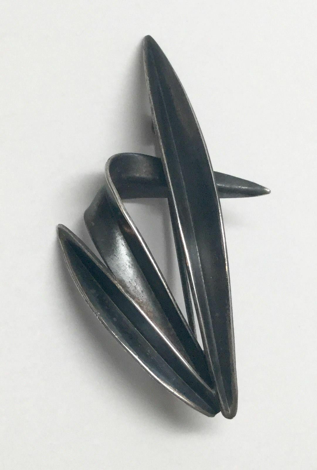 Vintage Denmark 1950's Anton Michelsen grass pin by Gertrude Engel.

Marked: crown over AM in rounded triangle, signed by Engel.

Measures: 2