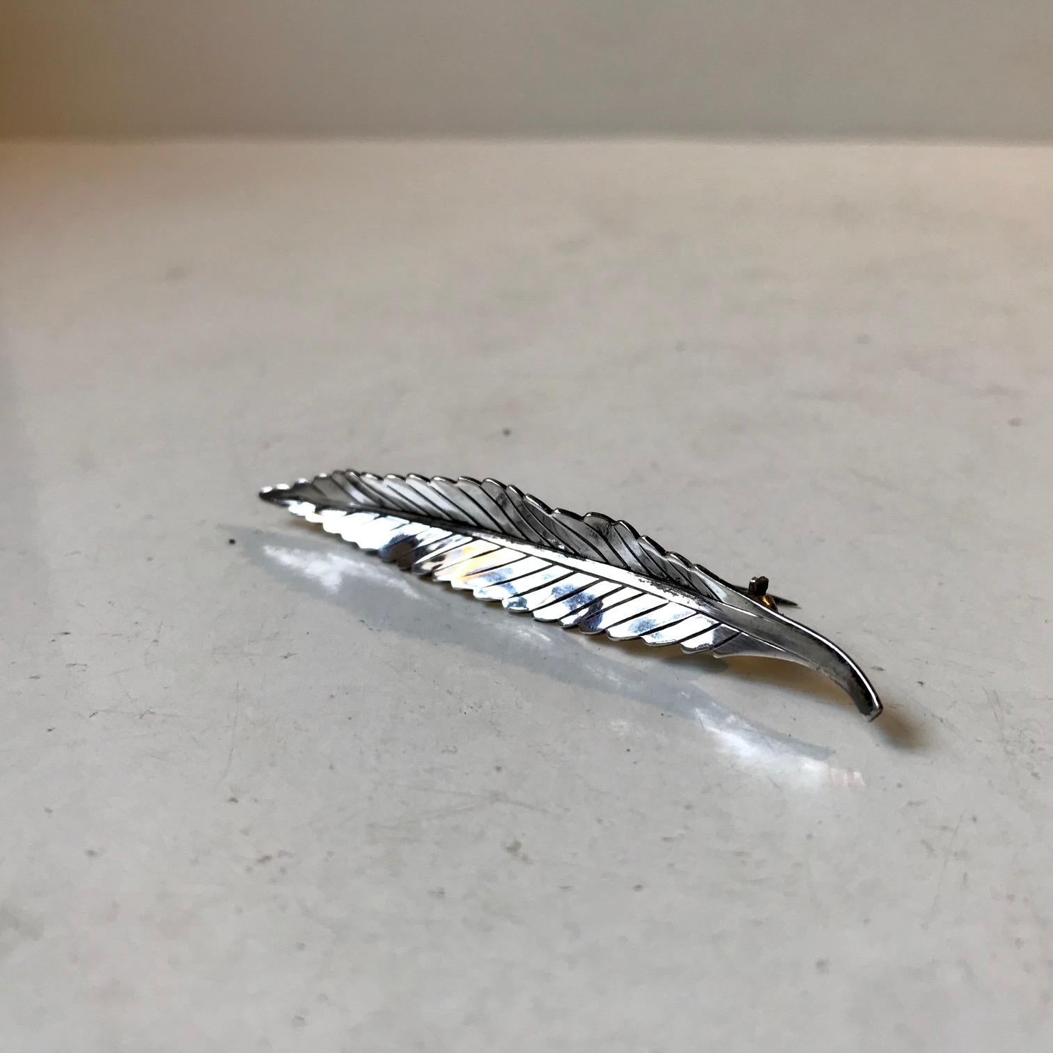 A naturalistically shaped leaf brooch in sterling silver 925/1000. Designed by Getrud Engel and made by Anton Michelsen in Denmark circa 1950. This particular leaf design is by far the rarest in the Michelsen line-up. It is hallmarked/signed: