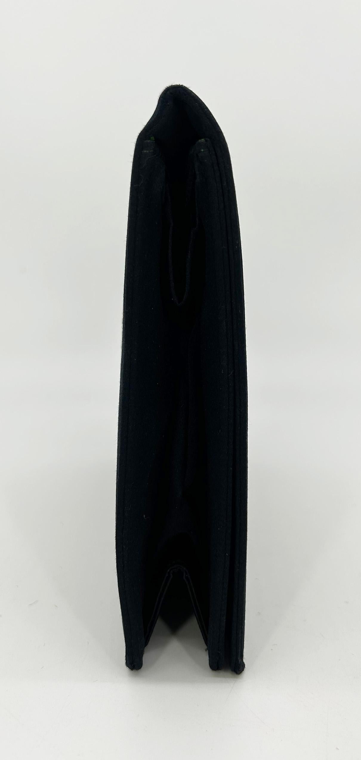 Vintage Anton Moritz Black Silk Glass Beaded Evening Bag Clutch c1960s in very good condition. Black silk exterior with glass beaded design on front & back sides. Front snap flap closure opens to a green satin interior with 3 side slit pockets which
