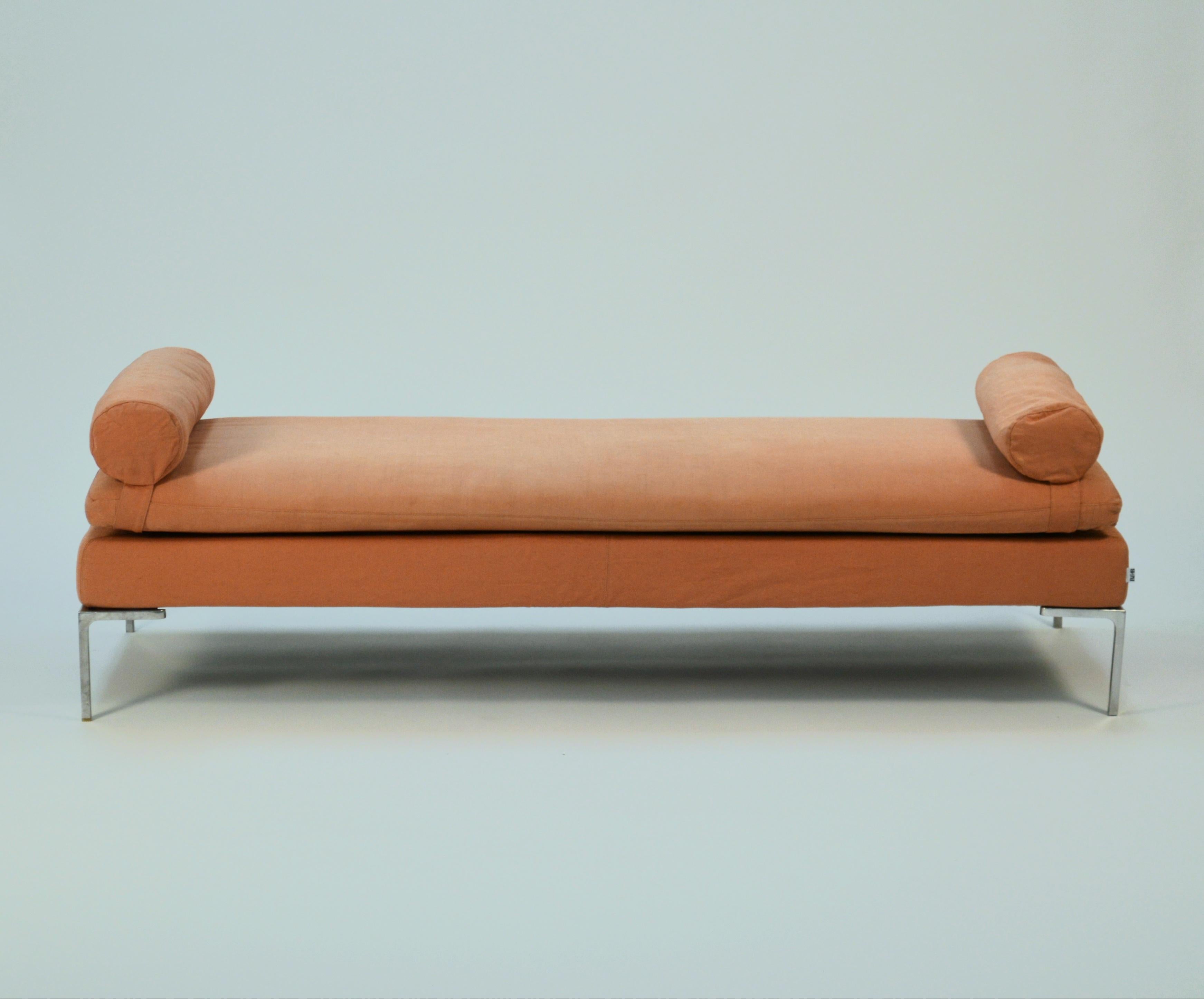 Antonio Citterio 'Charles' daybed sofa made by B&B Italia in 2000. Sofa is upholstered in its original light red-orange colored polyester/cotton blend upholstery. The piece has some UV fading due to age and has a beautiful soft hue closest to