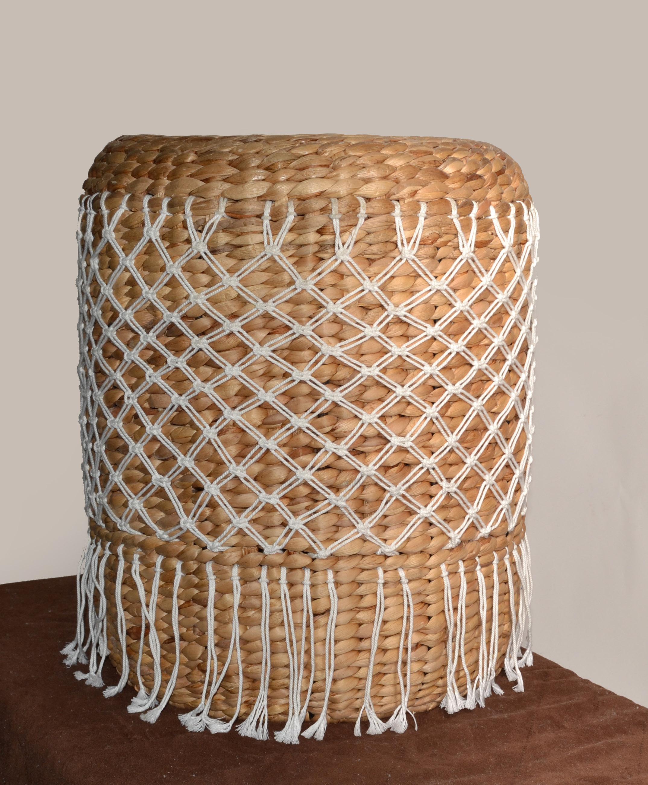 Reminiscent of exotic travels, the Apache Stool features a solid rattan frame supported by steel cross Top with water hyacinth webbing and cotton rope knot decor. 
Water hyacinth is a beautiful natural textural material. It is a fast-growing,