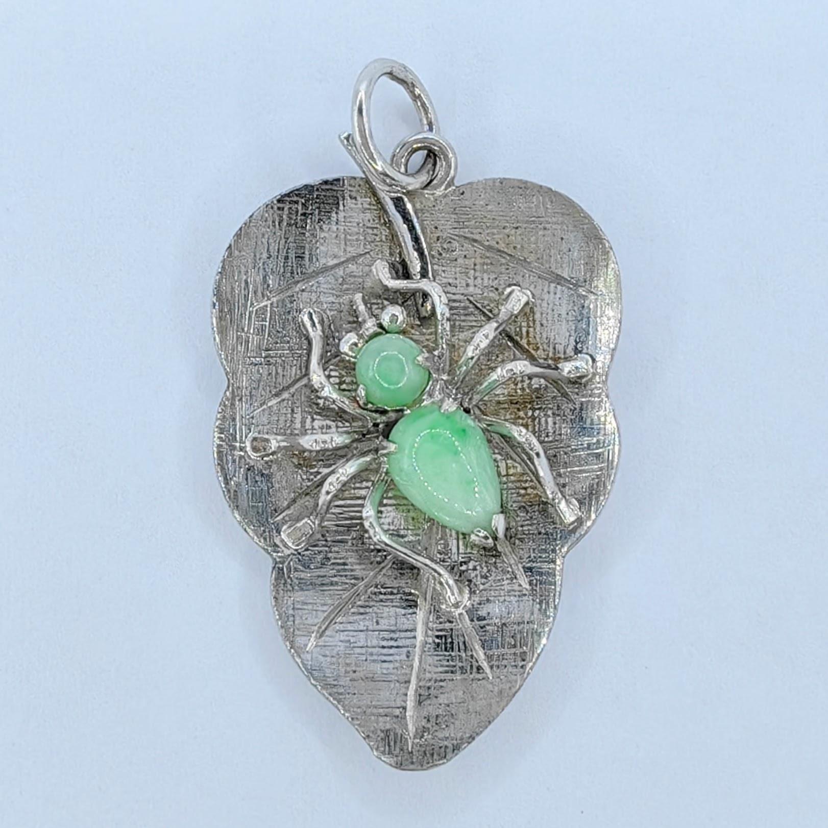 Presenting our exquisite Vintage Apple Green Burmese Jadeite Jade Spider on a Leaf 8K White Gold Pendant, an enchanting piece that combines the allure of Burmese jadeite jade with vintage charm. Meticulously crafted, this pendant showcases a