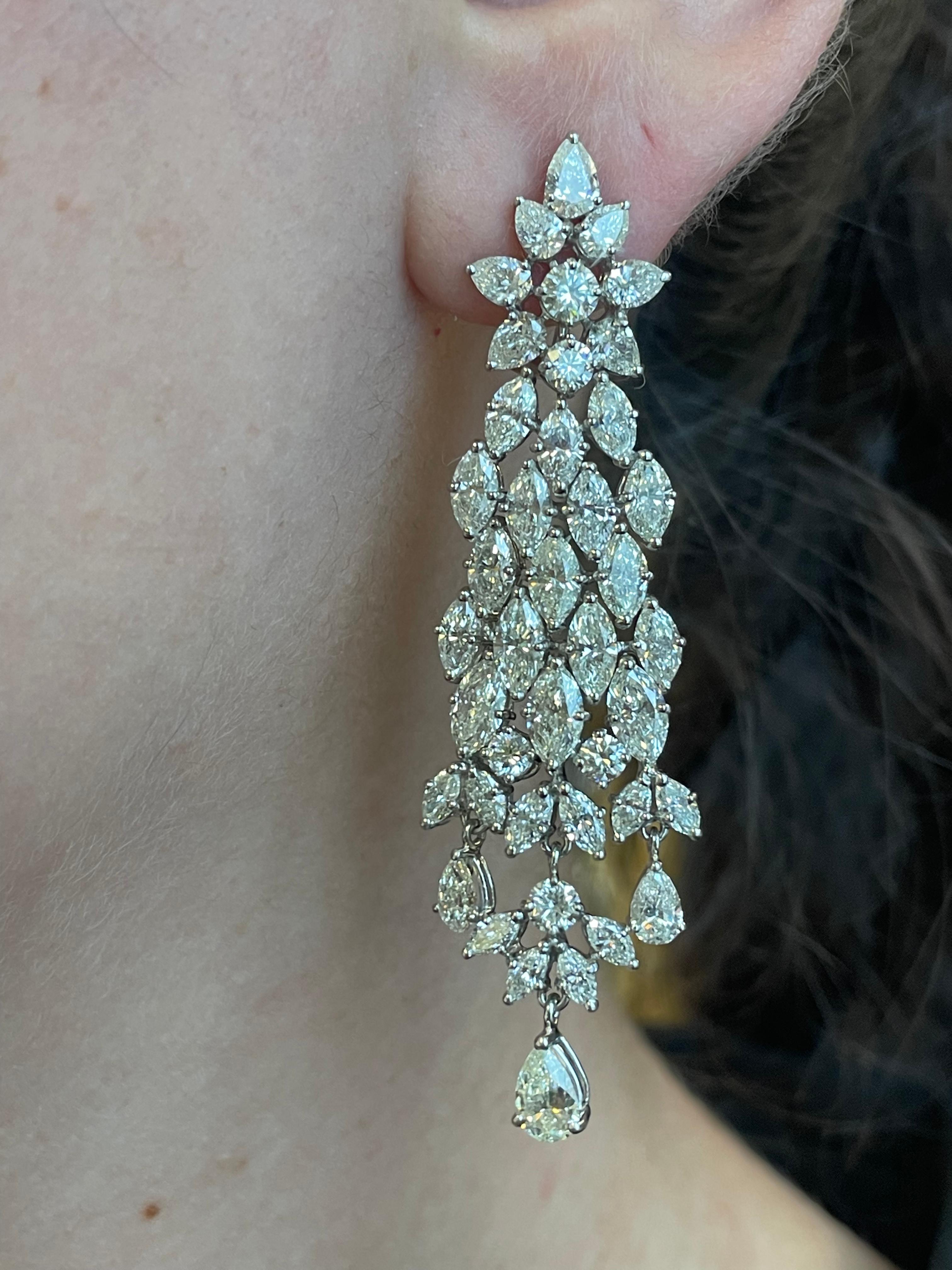 Absolutely stunning vintage high jewelry chandelier earrings, with a very Harry Winston look.
Approximately 15.80 carats of pear, marquise and round brilliant diamonds. Approximately H/I color grade and VS clarity grade. White gold, 19.53 grams,