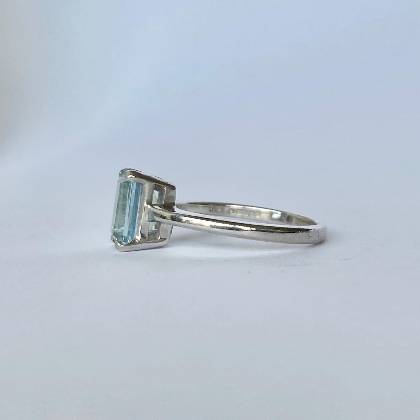 This stunning aqua is pale in colour and has a cut which gives a hall of mirrors effect. The shoulders, setting and band is modelled in 18ct white gold and is very simple in design. The stone measures approx 1carat. 

Ring Size: K or 5 1/4 
Height