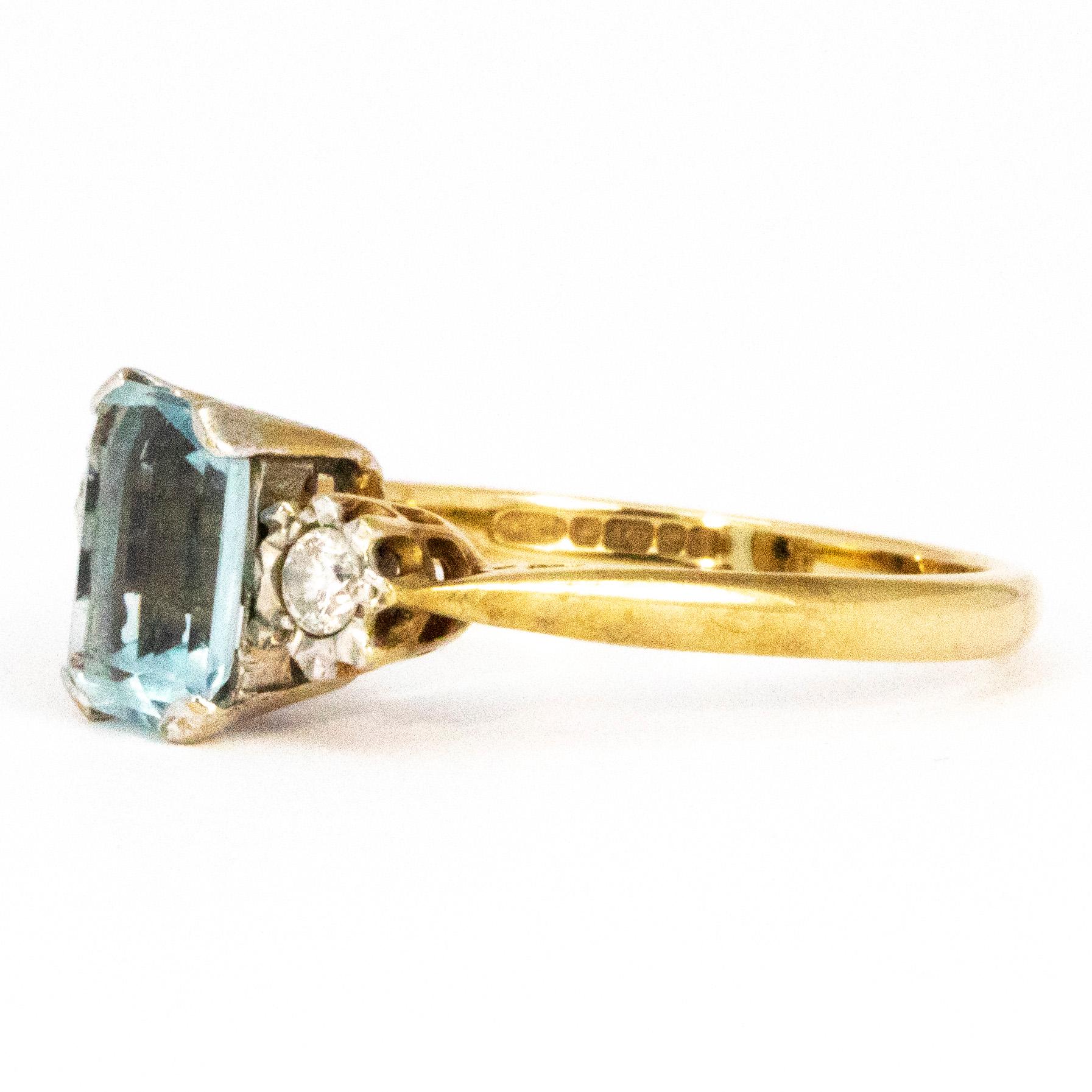 The centre stone on this gorgeous ring is an emerald cut aqua stone measuring 1carat. Either side of this pale blue stone are two round cut diamonds measuring 10pts each. The contrasting shapes of the stones make this ring very stylish. Modelled in