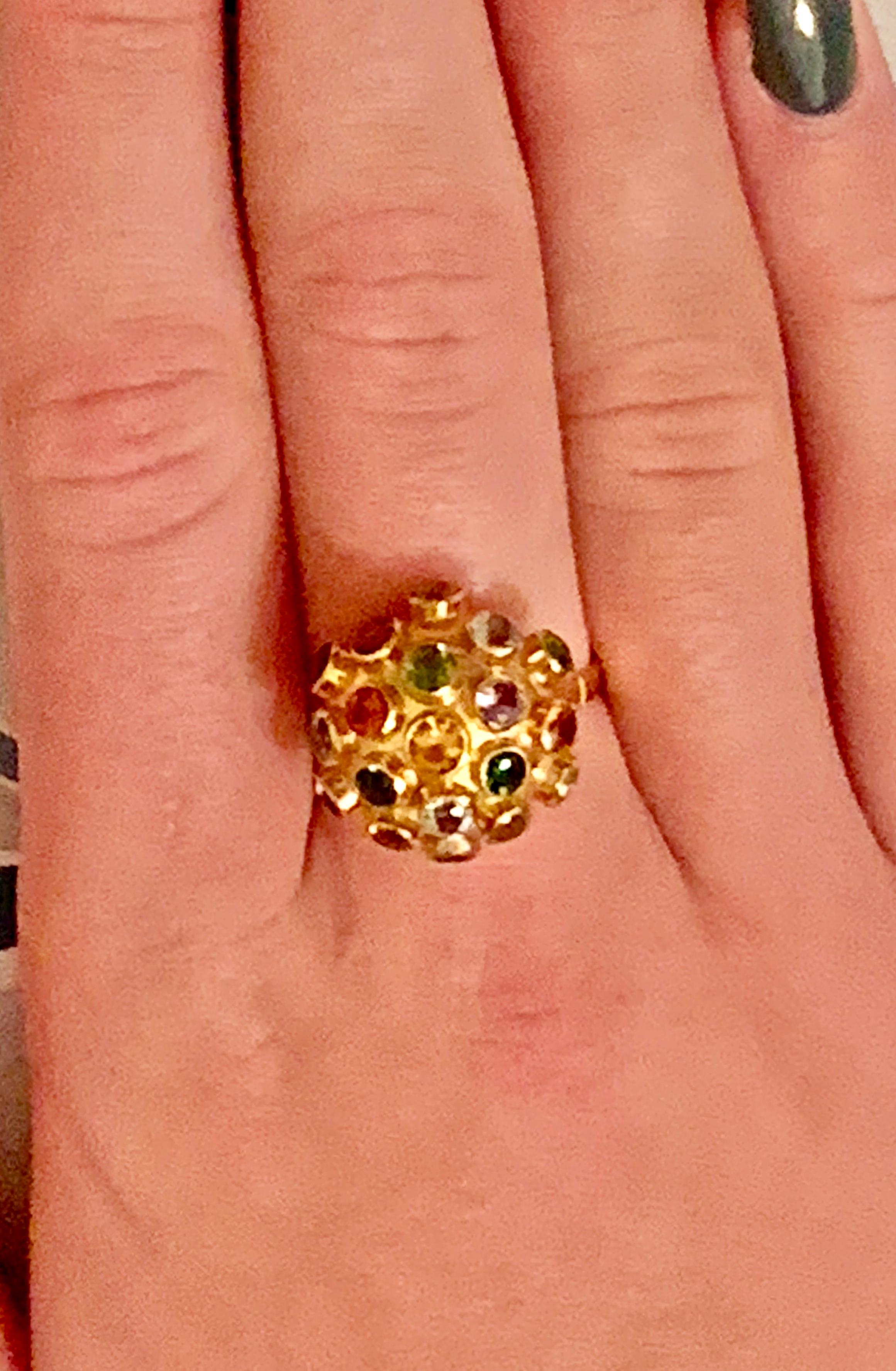 This vintage Sputnik 18karat yellow Gold ring features 3.5mm faceted stones including Amethyst, Aquamarine, Citrine, and various colors of Tourmaline. 

Size: 10 1/4 - this ring is resizable but vendor does not offer sizing services. 
Weight: 4.2