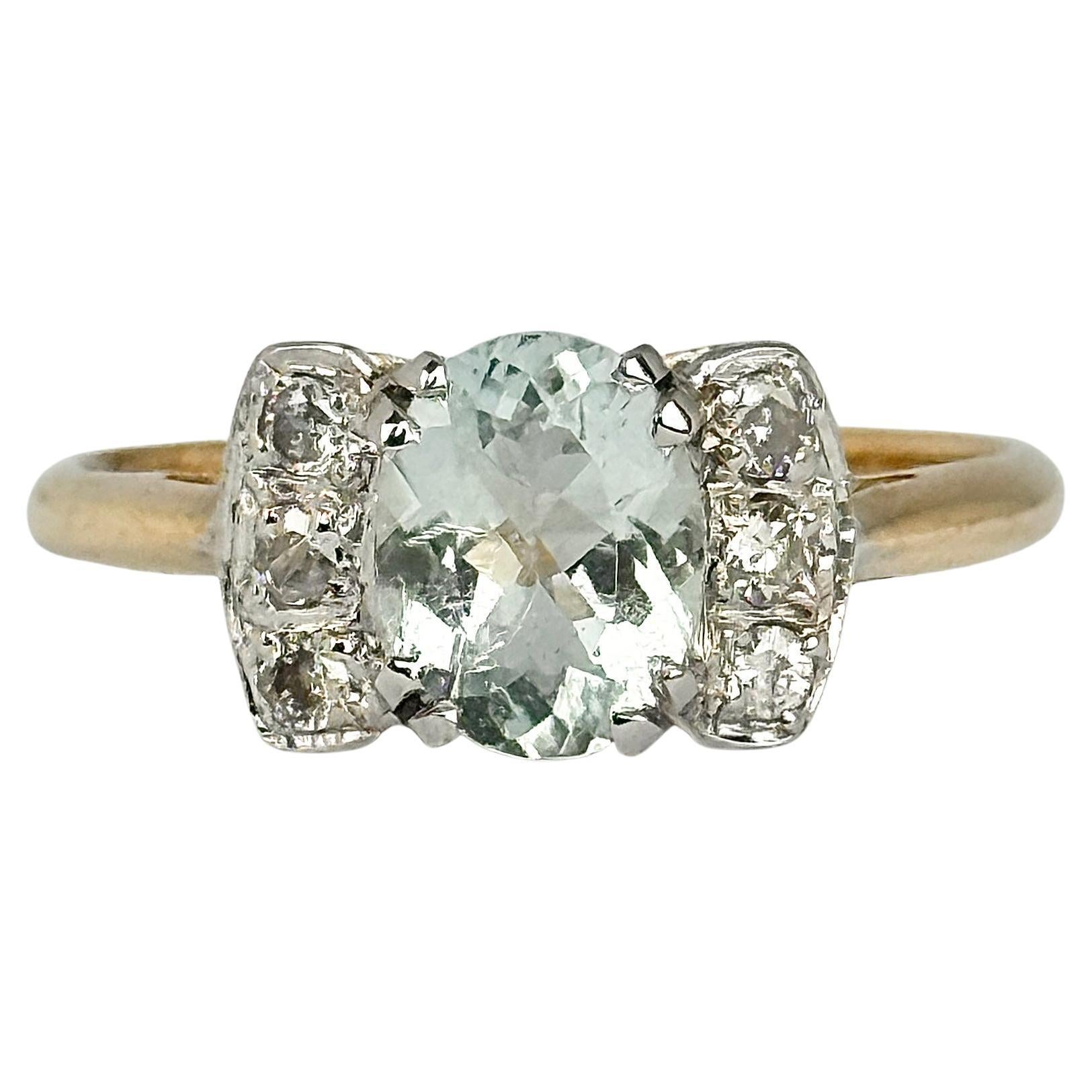 Anello solitario vintage con acquamarina e diamante in oro 18 carati