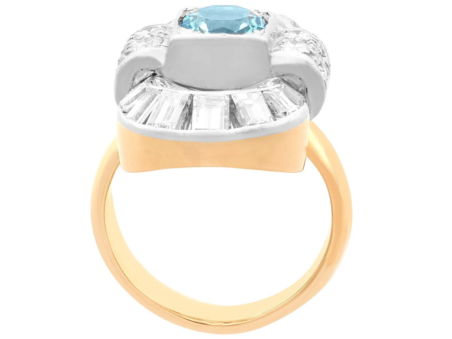 A stunning, fine and impressive 0.88 carat aquamarine and 2.02 carat diamond, 18 karat yellow gold and platinum set cluster ring; part of our diverse antique jewelry collections.

This stunning, fine and impressive Art Deco ring has been crafted in