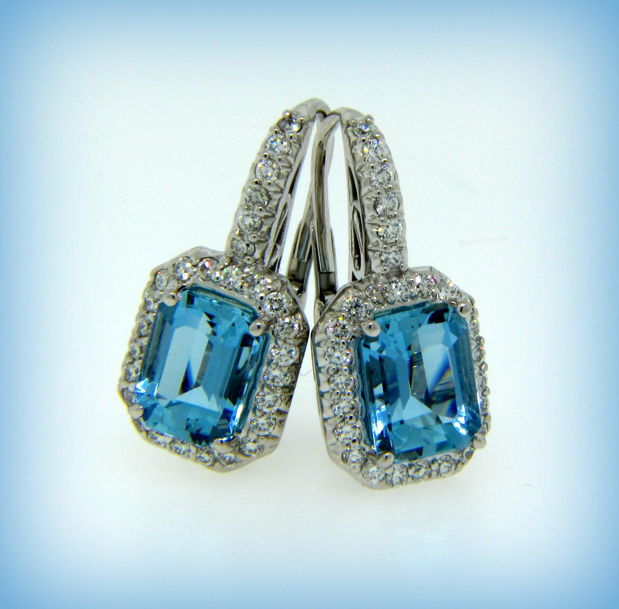 These Vintage Aquamarine Earrings are set in Diamond Studded White Gold.

These beutiful earrings consist of:

2 Aquamarines of excellent quality weighing a total of 4.13 cts. 

These Aquamarines are set with 56 Round Brilliant Diamonds weighing a